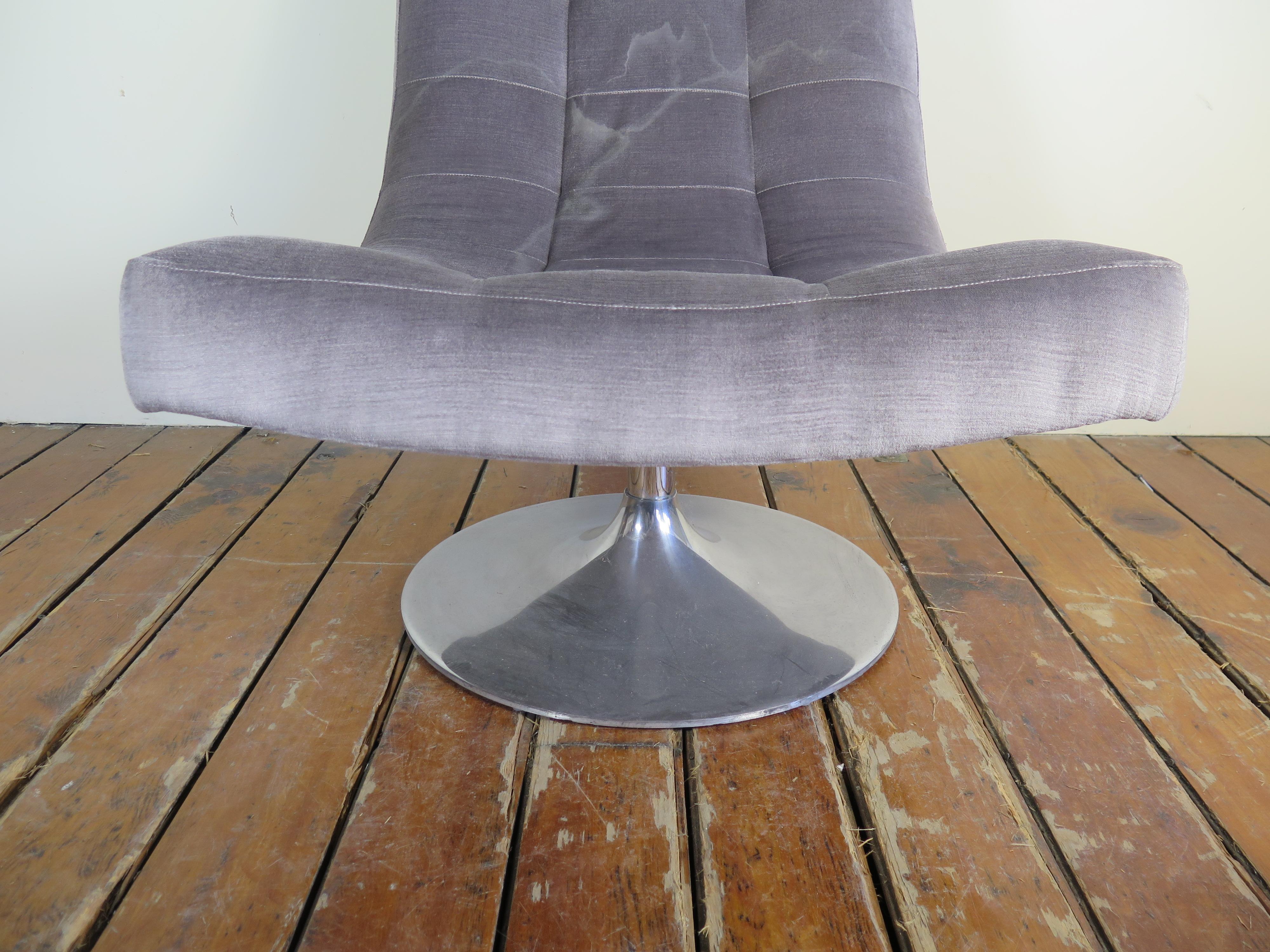 Mauve Lee Industries waffle tufted swivel chair.