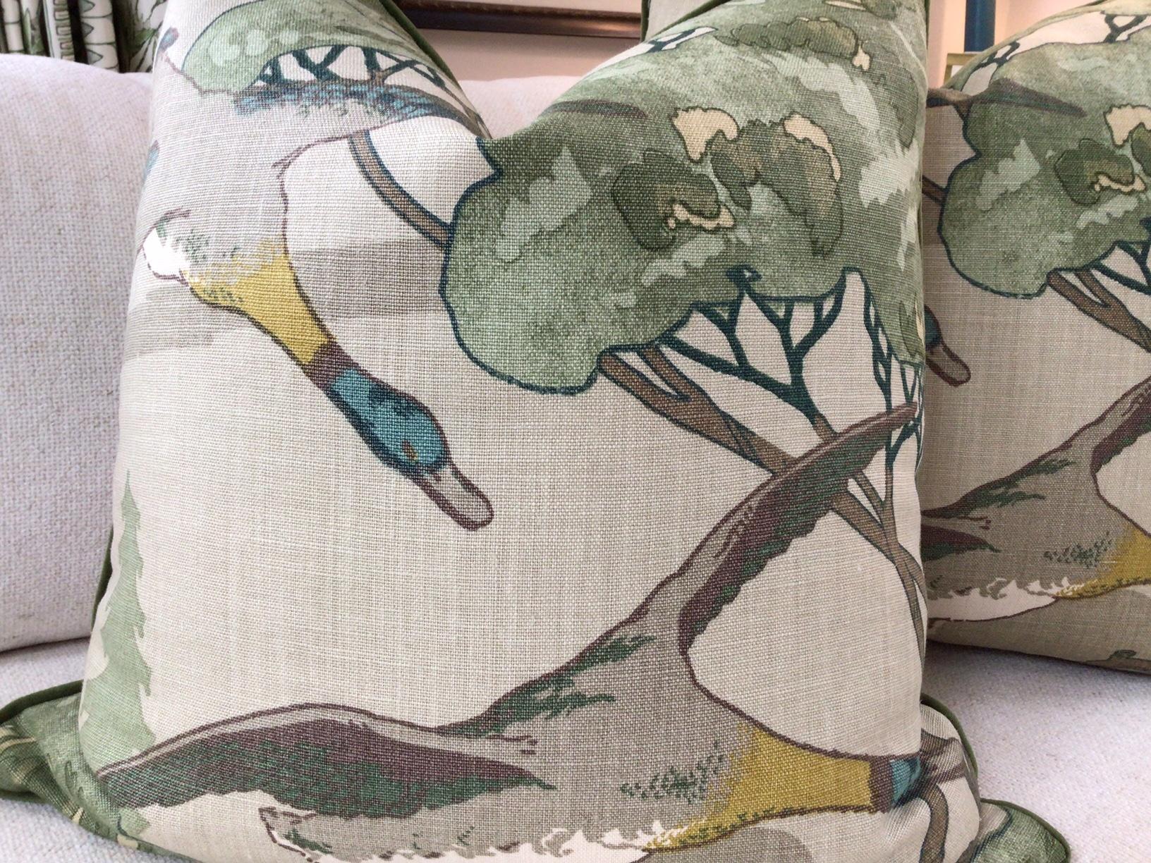 BEAUTIFUL and reminiscent of an English country Manor home, Lee Jofa's “Flying Ducks” is a lovely pattern from Mulberry and features ducks in flight in rich colors of Rich tones of green, teal, tan, and yellow. This exquisite scene is on a tan linen