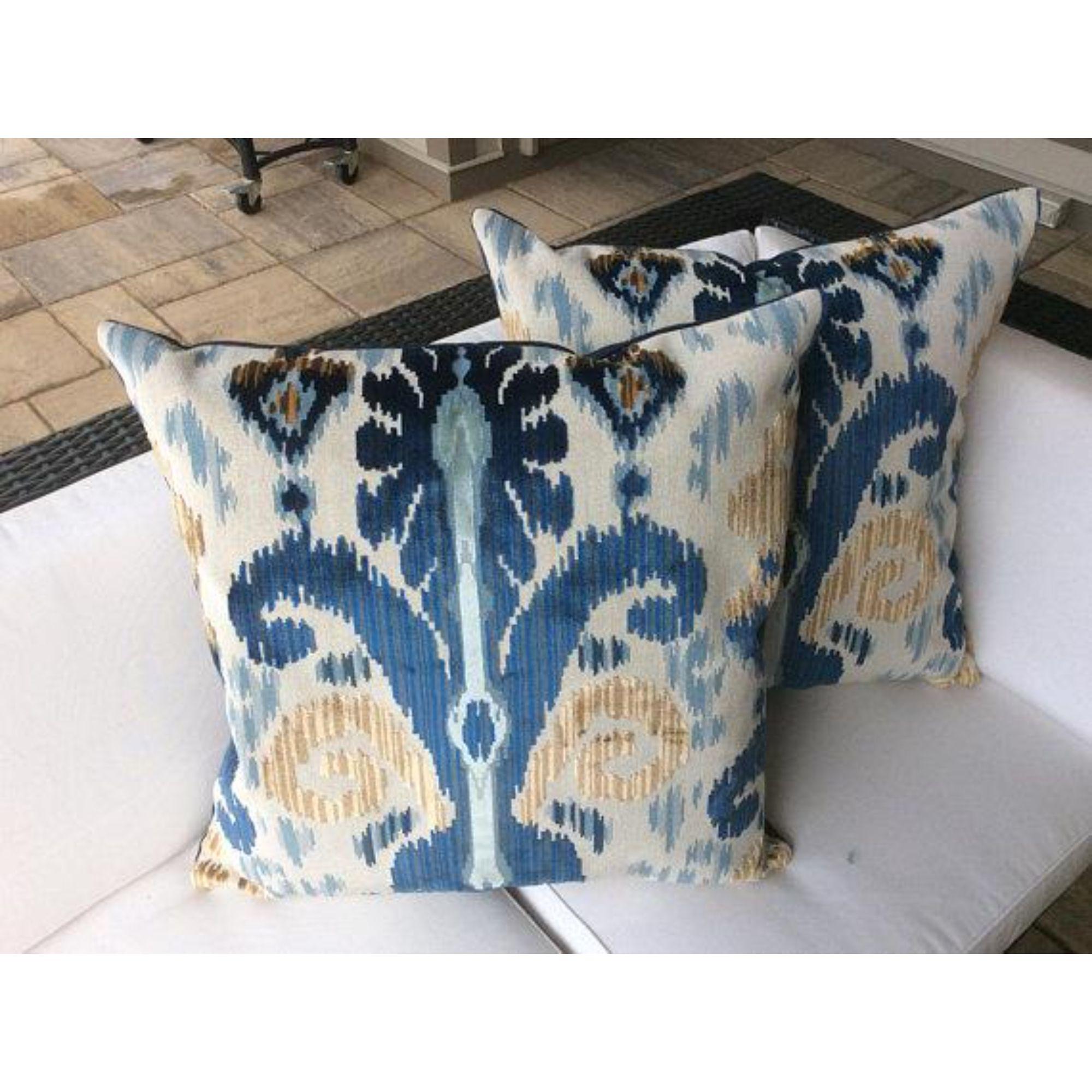 Stunningly beautiful Belgian cut velvet from esteemed Lee Jofa, this Ikat design is rich, intricate, and saturated with colors of cobalt blue and golden tan on white. This pair of pillows is corded and backed in cobalt blue velvet.

These handmade