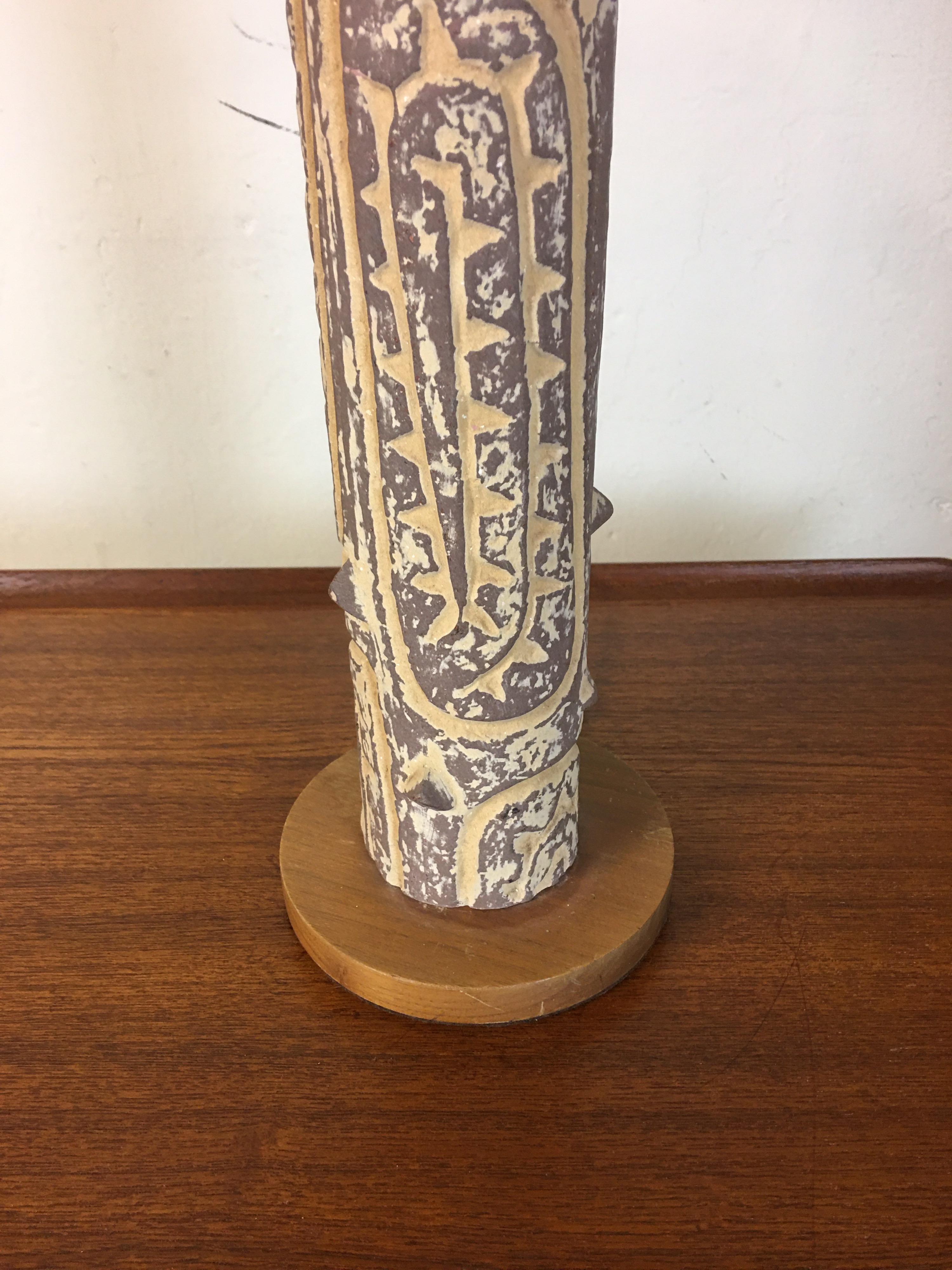 Lee Rosen for Design technics incised tree like ceramic table lamp. I have seen lamps with this patterned column in differing heights. Many models were made of the tubes. Ceramic body sits on a simple wood base. Body of lamp with wood base measures: