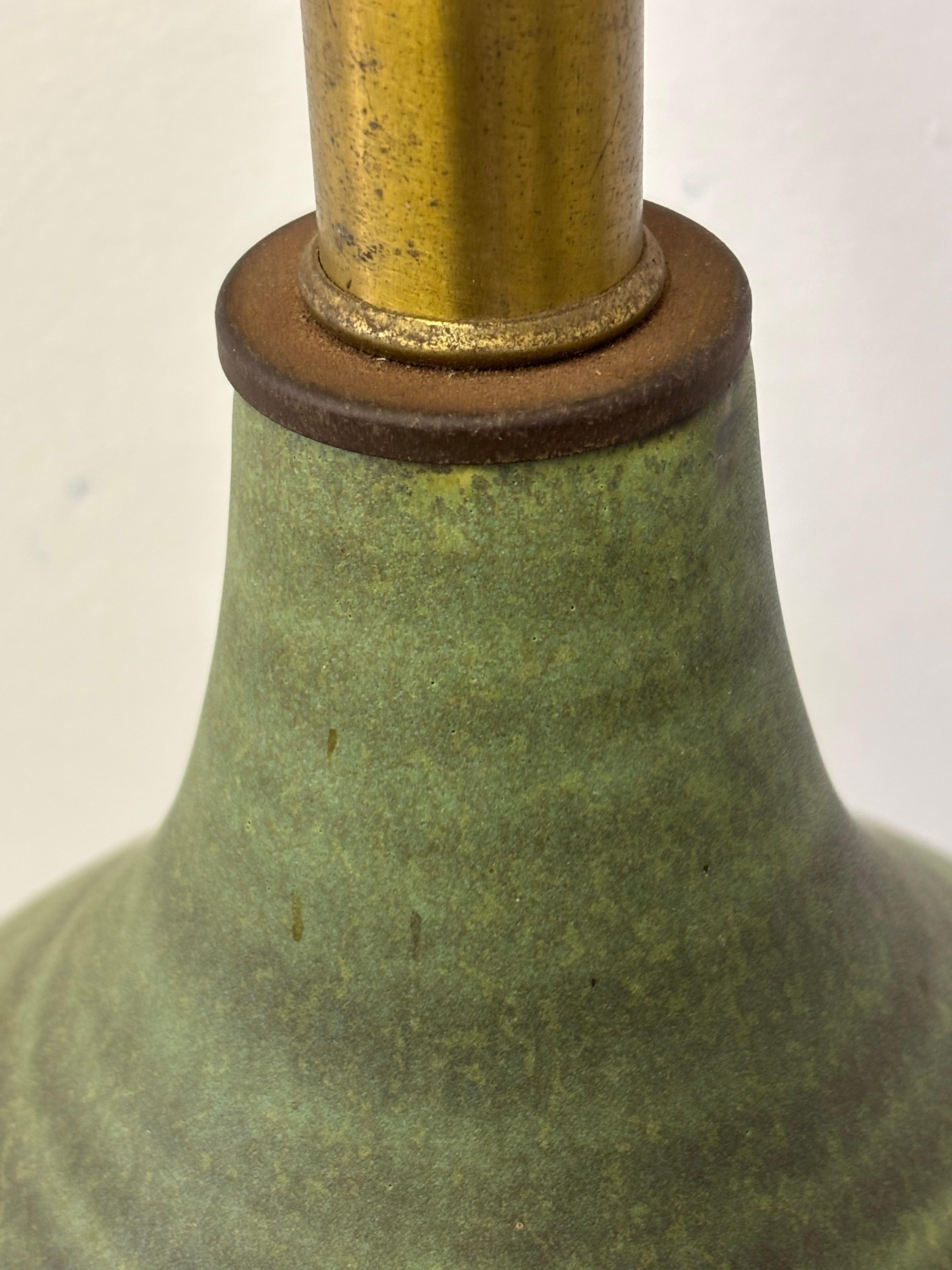 Lee Rosen for Design Technics Ceramic Table Lamp in a green Glaze.  Uncommon lamp with a rare glaze color.  In very nice original shape.  7