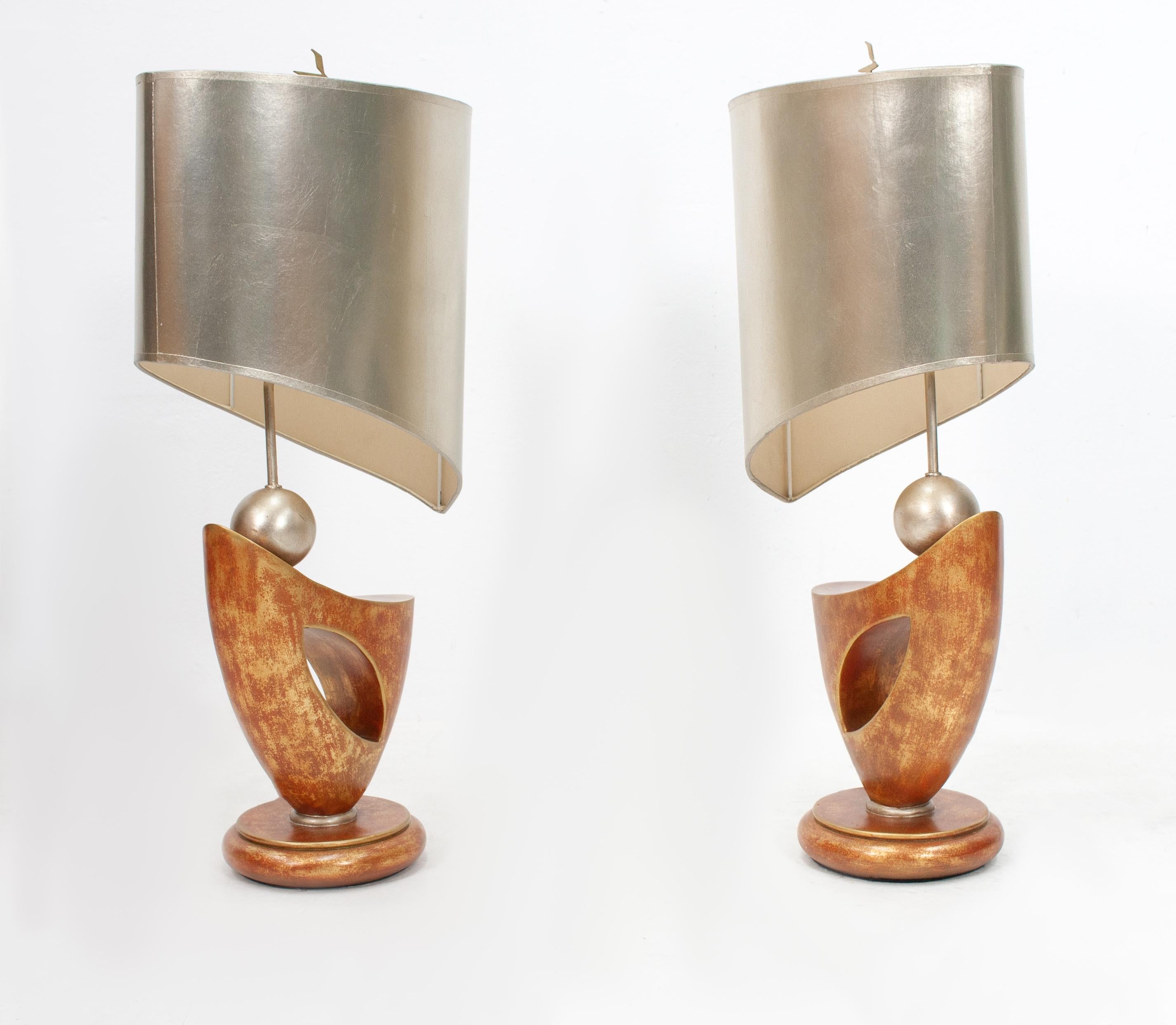 Two Leeazanne ceramic table lights with there original shades. Terracotta and silver color base. Comes with a silver color shade. Hollywood Regency in style. Manufactured and signed by Leeazanne, USA, 1980.

Measures: Height 75 cm, width 37 cm,
