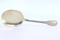 Left-handed silver ice cream scoop with grooved handle and monogram