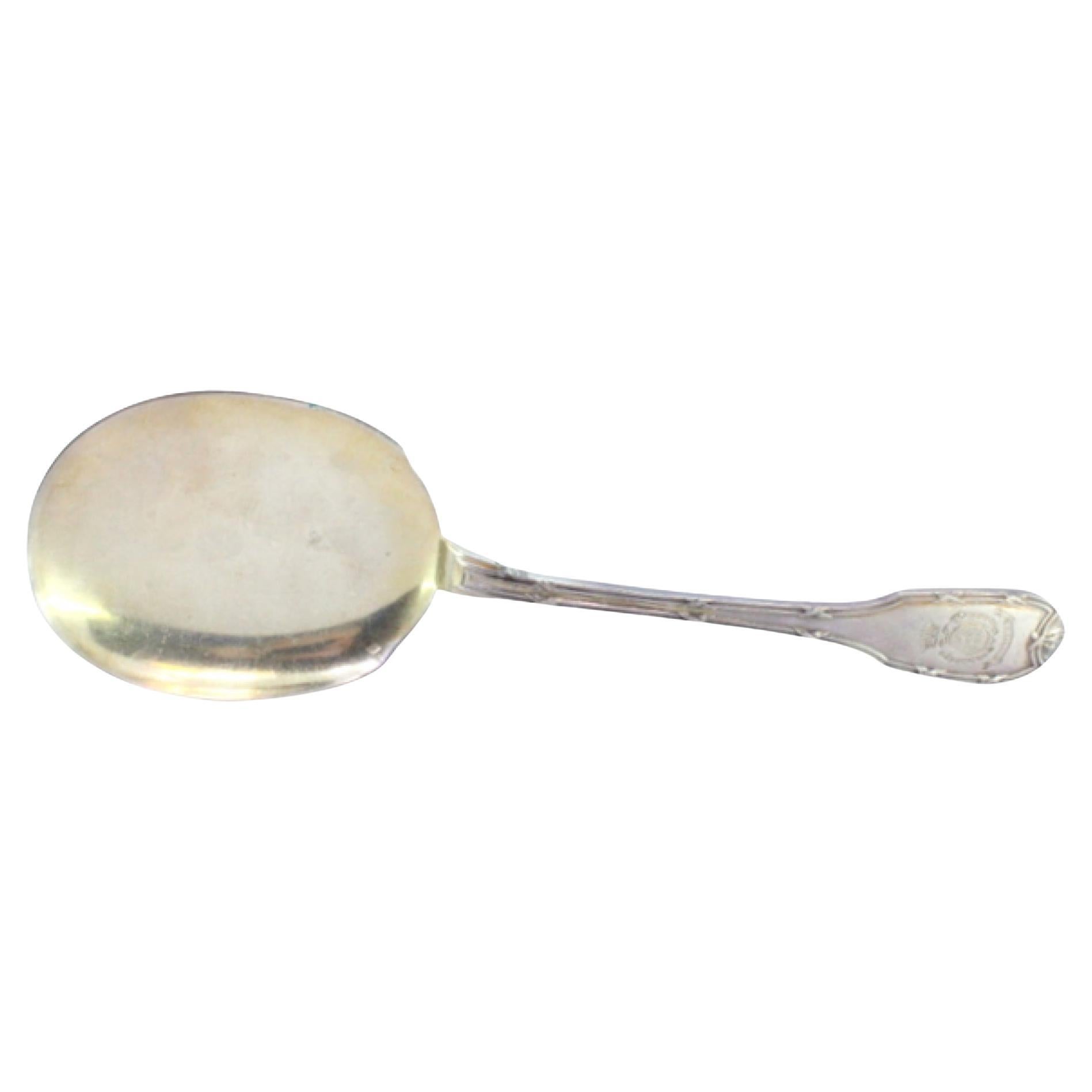 Left-handed silver ice cream scoop with grooved handle and monogram