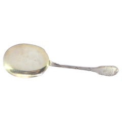Left-handed silver ice cream scoop with grooved handle and monogram