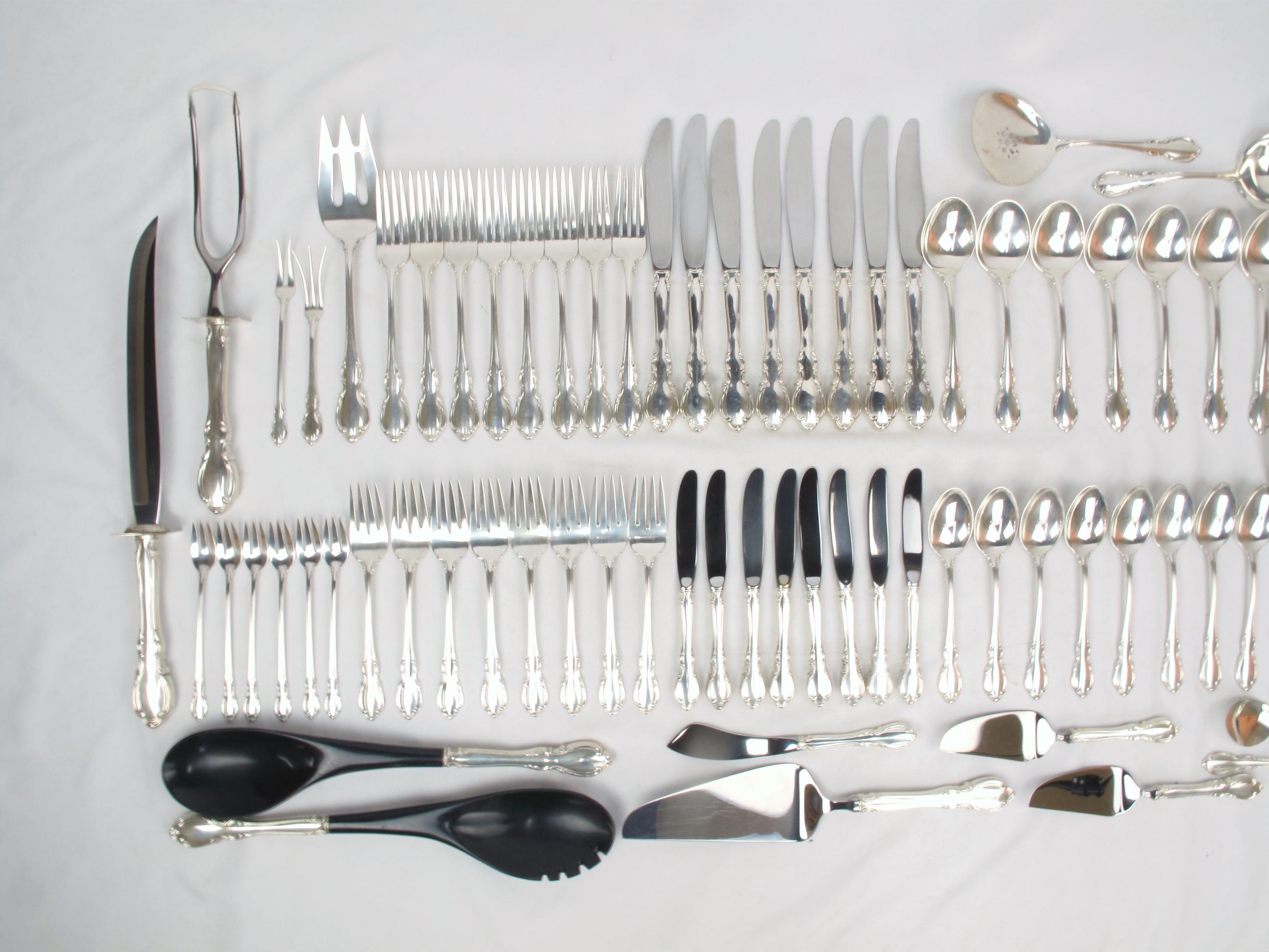 Towle Legato sterling flatware set. Introduced in 1962, the Legato pattern features traditional curves and contours restrained by a modern touch, emphasizing the graceful handle of this pattern. Refined and sophisticated yet rich.

75 pieces.