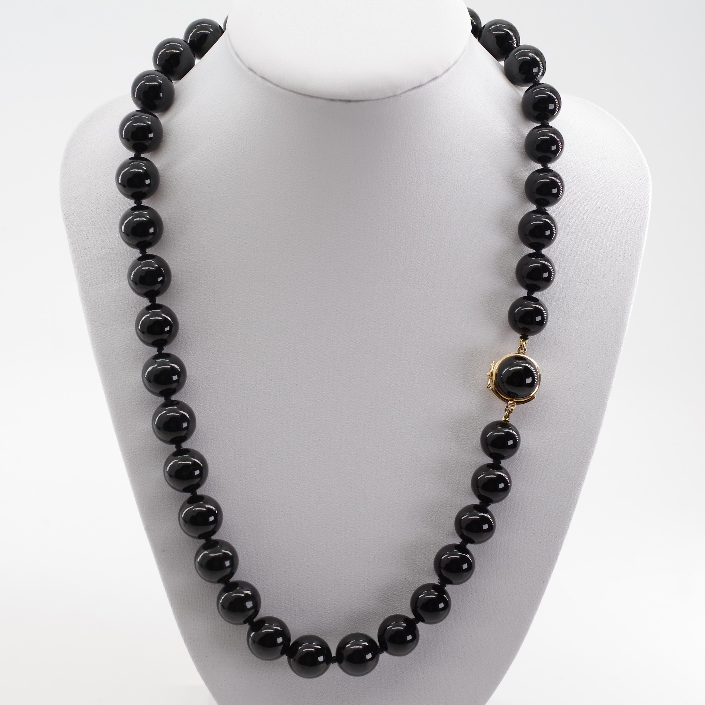 This iconic necklace is the definitive authentic Gump's black jade necklace. Gump's, in case you are not familiar with the name, was a legendary San Francisco emporium that became world-renowned for its Asian art and jewelry, especially its jade