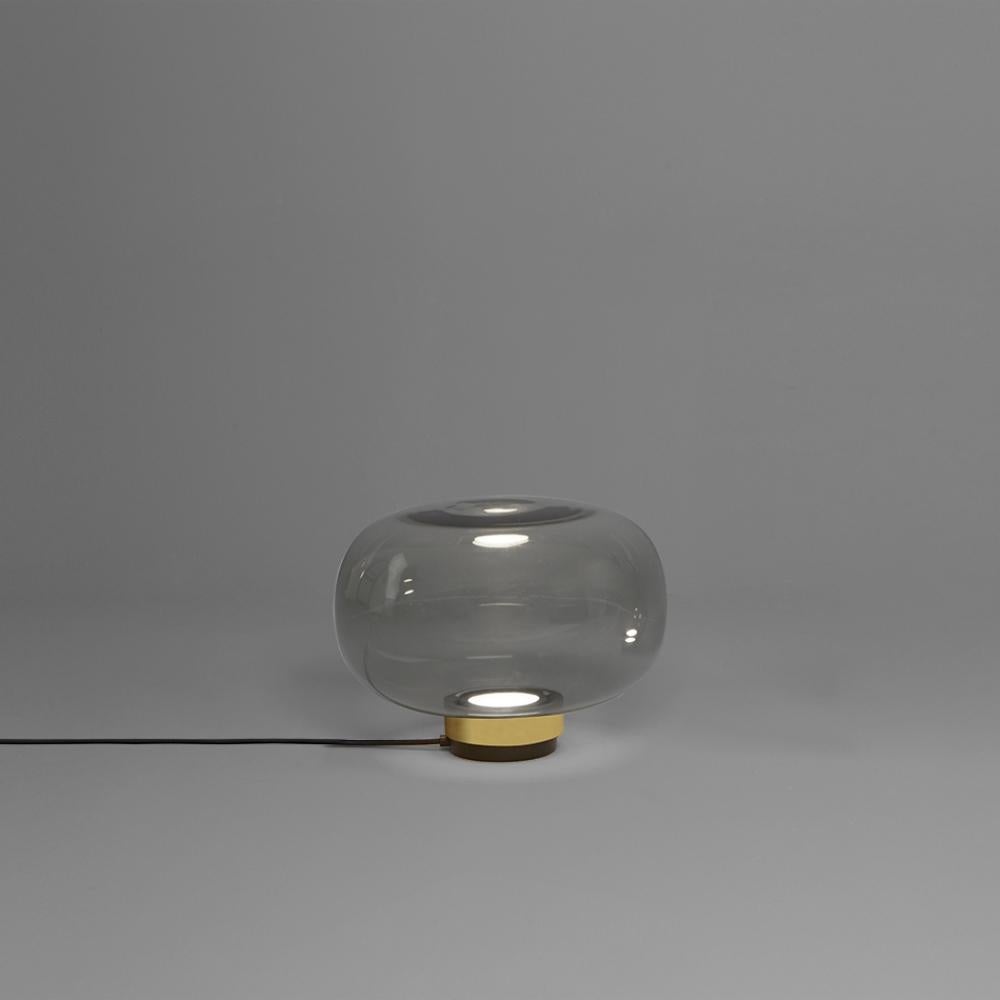 Table lamp inspired by the classical shapes of Murano diffuser which is usually used as decoration anywhere in a house; elegant spherical shape apparently fragile yet very robust and functional. The lamp can have the connection in galvanic copper,