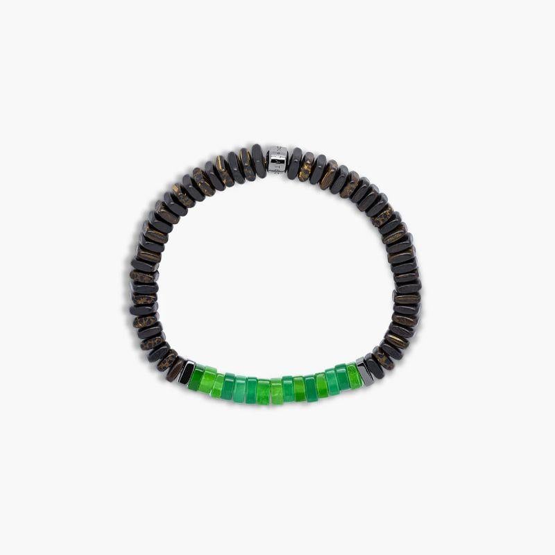 Legno Bracelet in Green Quartz, Palm and Ebony Wood with Black Rhodium Plated Sterling Silver, Size L

Ebony and palm wood beads are accented by hand-polished, black rhodium plated sterling silver discs with green quartz stones sitting in the centre