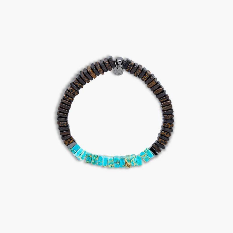 Legno Bracelet in Impression Jasper, Palm and Ebony Wood with Rose Gold Plated Sterling Silver, Size L

Ebony and palm wood beads are accented by hand-polished black rhodium plated sterling silver discs with impression jasper stones sitting in the