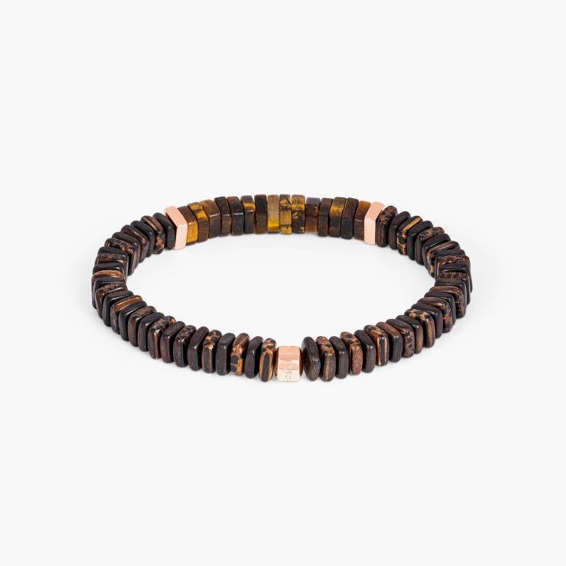 Legno Bracelet in Tiger Eye, Palm and Ebony Wood with Rose Gold Plated Sterling Silver, Size M

Ebony and palm wood beads are accented by rose gold-coloured, hand-polished sterling silver discs with Tiger eye stones sitting in the centre for a