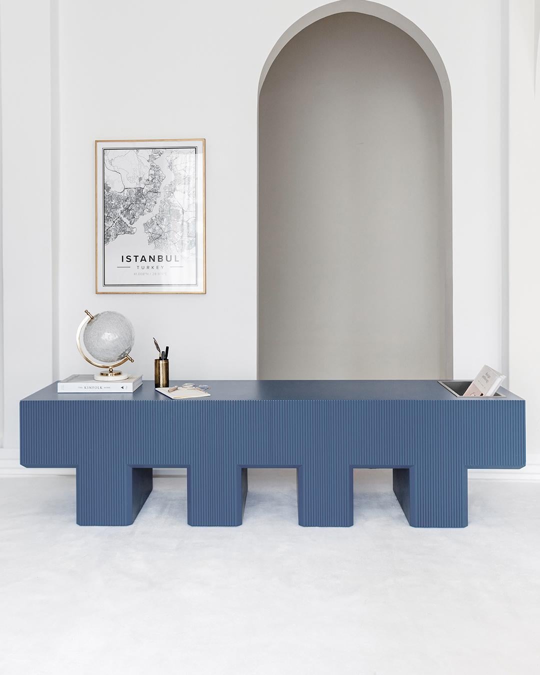The Lego Bench looks exactly like its name, with several blocky feet that give it an anthropomorphic feel. It’s not only sculptural but practical as you can store your magazines and books in the storage chamber at the end.

Lego Bench brings an