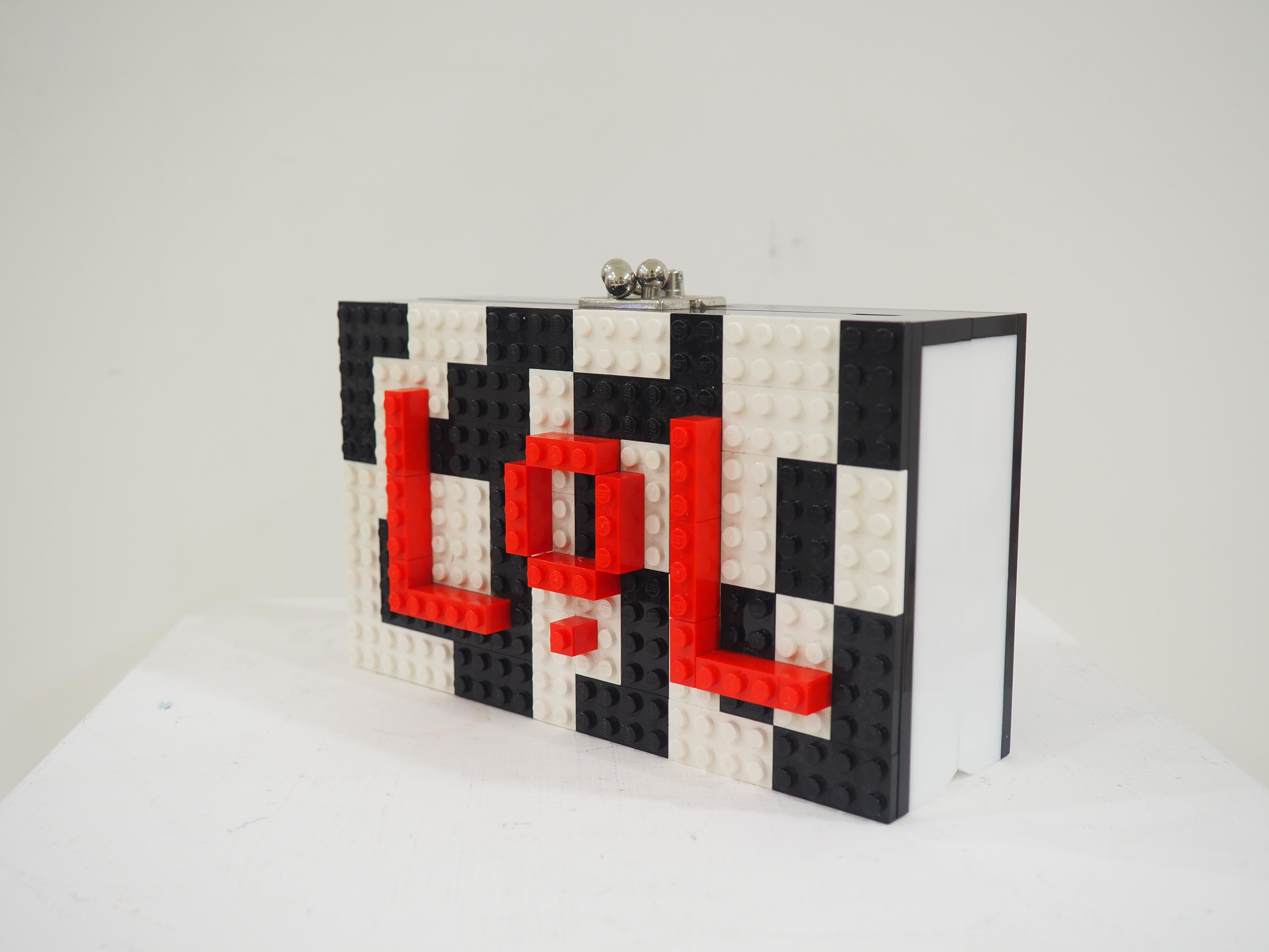 Lego Lol bag
shoulder or handle bag
in the inside leather
