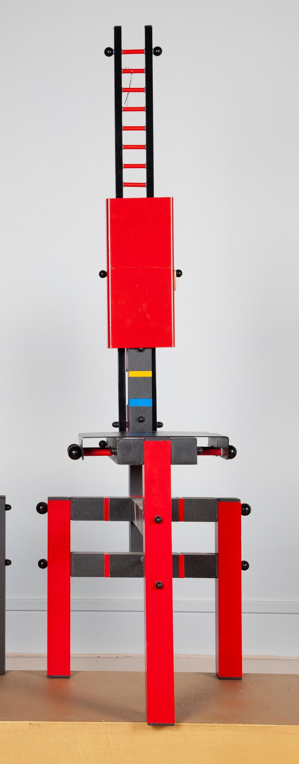 Lego red-black chair
Work from the 1980s
Metal, wood 
Measures: H: 132 cm, W: 44 cm, D: 47 cm.