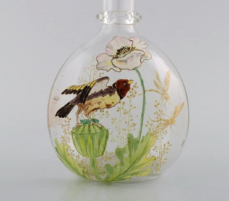 Legras, France. Carafe with hand painted enamel decoration in mouth-blown art glass. Birds and flowers, 1890s.
In very good condition.
Measures: 24 x 13.5 cm.
Literature: Marie-Françoise Jean-François Michel, Dominique and Jean Vitrat: