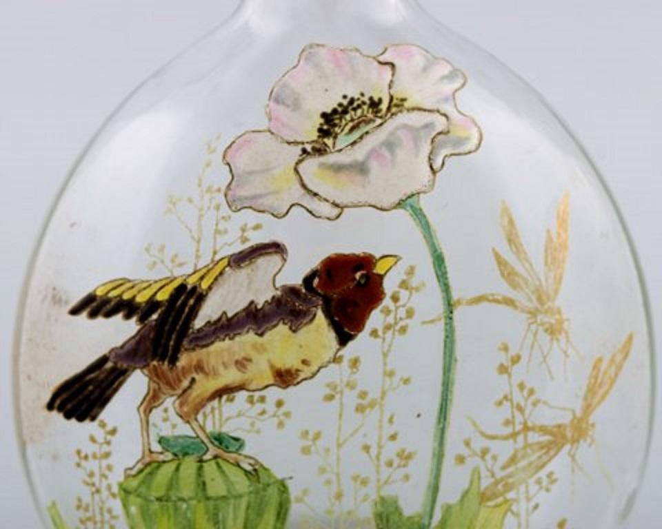 French Legras, France. Carafe with Hand Painted Enamel Decoration in Art Glass For Sale