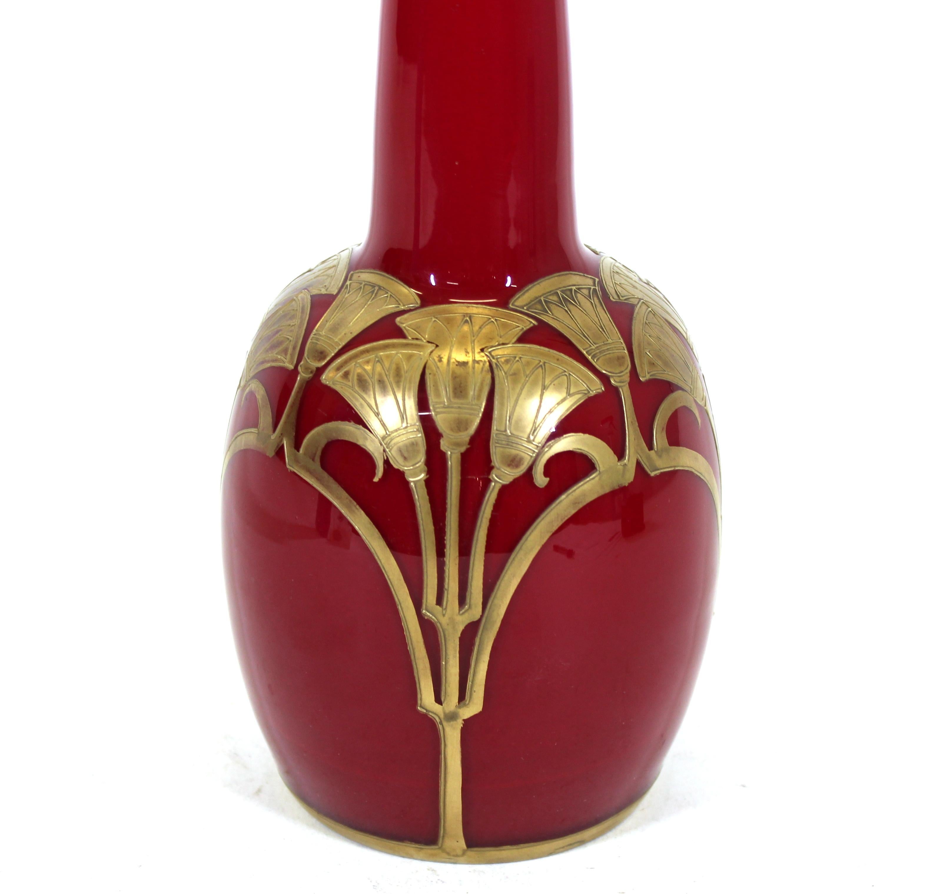Legras Saint Denis French Egyptian Revival blown 'rouge de chine' red glass vase over white opaline glass and enameled and gilt with 24K gold lotus motif. Marked on the bottom. In remarkable antique condition with age-appropriate wear.