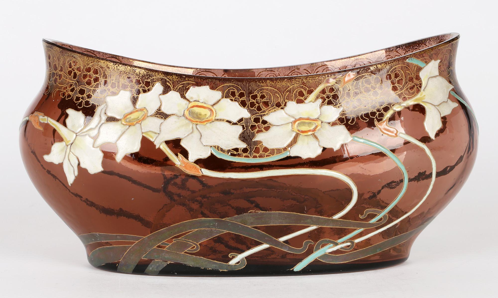 A stunning and rare French Art Nouveau floral enameled art glass jardiniere by Legras Mont Joye and dating from around 1900. Probably one of the best examples we have seen the jardiniere is of long narrow shape with rounded and shaped edges and is
