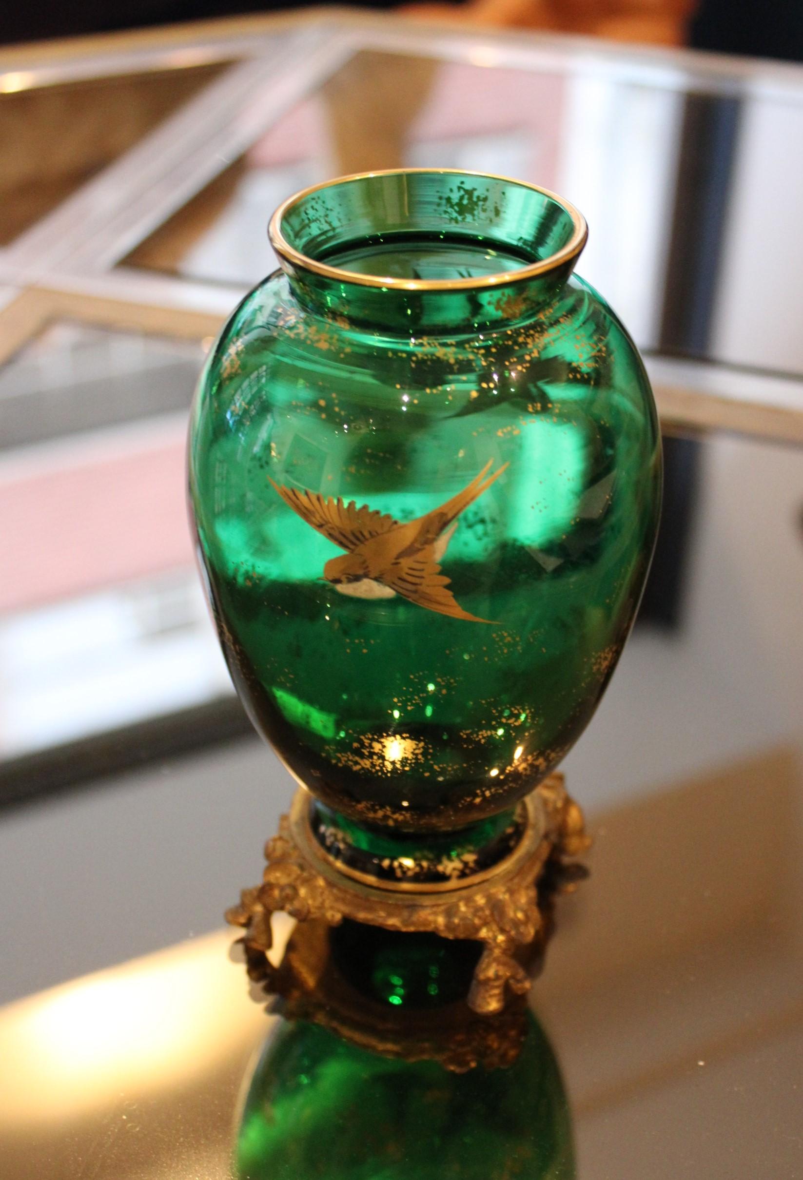 Glass vase on a carved metal mount
Green color, decorated with birds
Early 20th century.