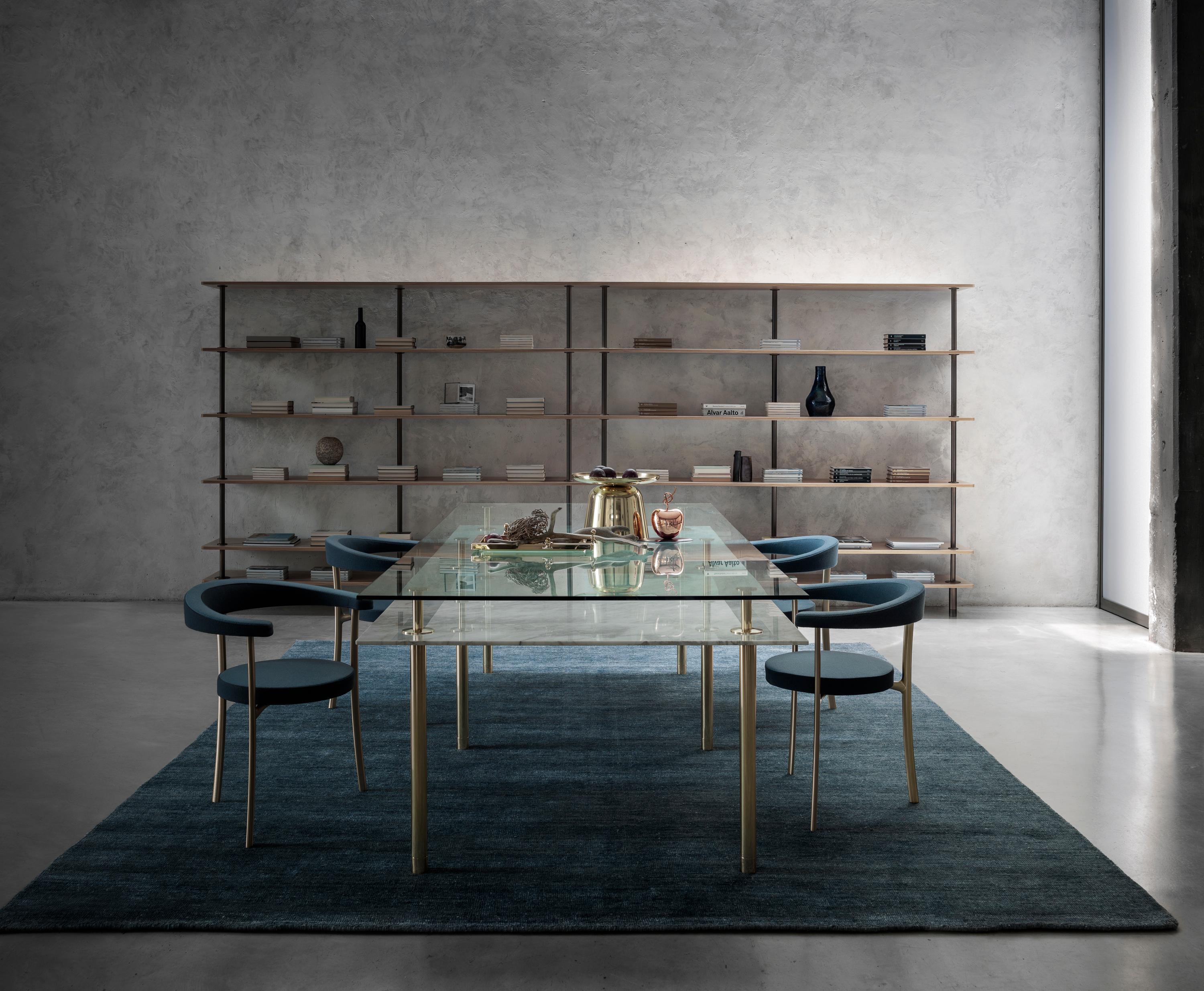 Table in crystal and brass. The designer imagines a turning point in the use of such a precious finishes such as polished brass: from the idea of almost a unique object in its perfect craftsmanship, to the system to be built starting from the base.