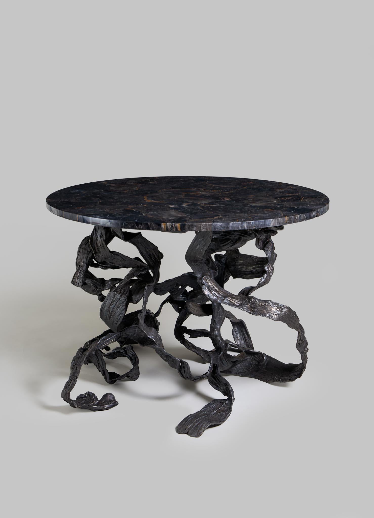 Leher Foyer Table in Brass & Semi Precious Overlay Top, Viya by Vikram Goyal

Wavy, weighty, and wondrous, the Leher foyer table reimagines nature’s motion in metal. Cast in brass, the fluid forms mimic the tie-and-dye patterns of the Leheriya