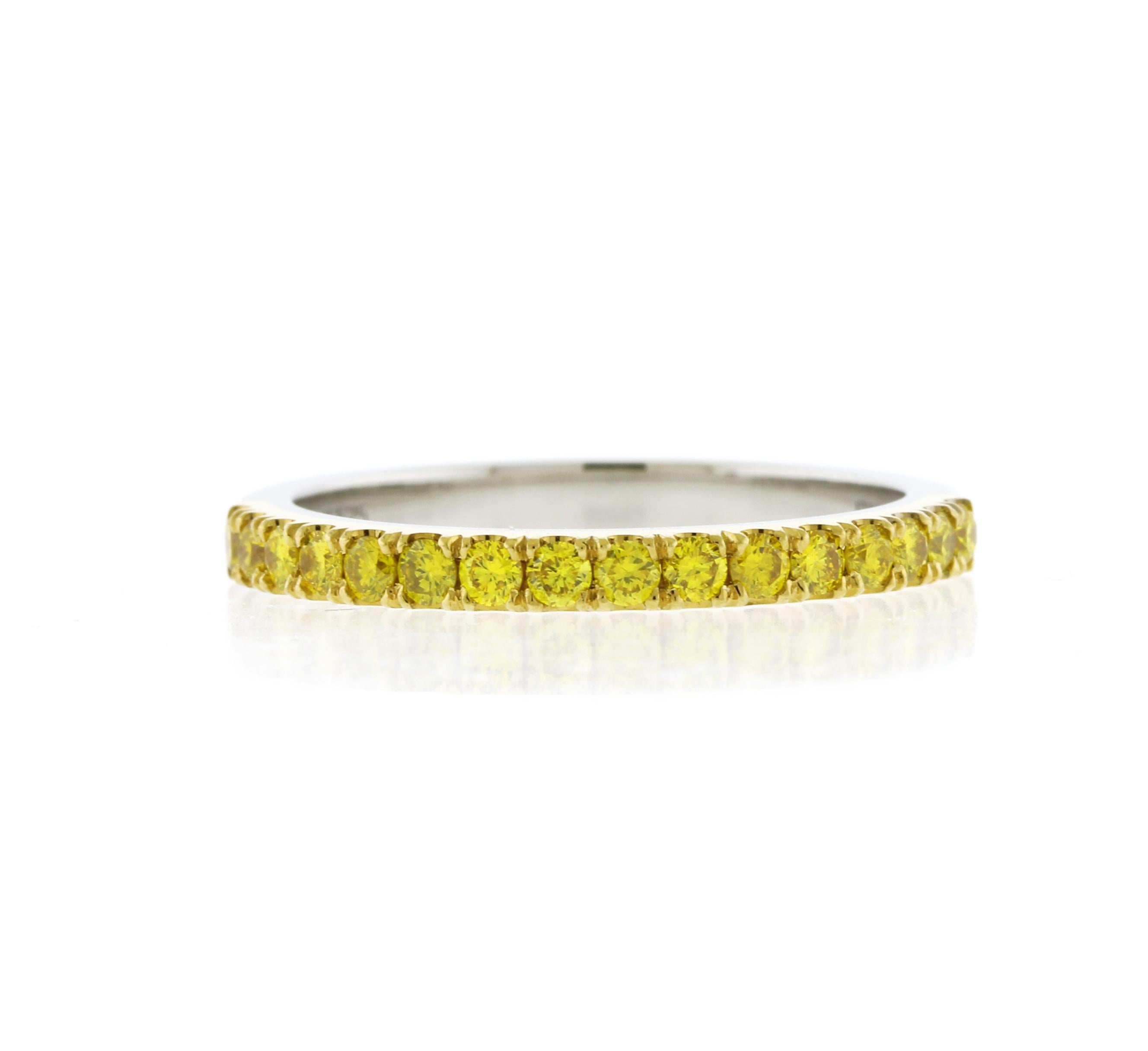 From Leibish the word leader in fancy diamonds.  Their classic open pave diamond wedding band, with fancy vivid yellow brilliant diamonds weighing 0.35 carats and styled in an open pave design. The ring is mounted in 18K yellow gold and platinum.