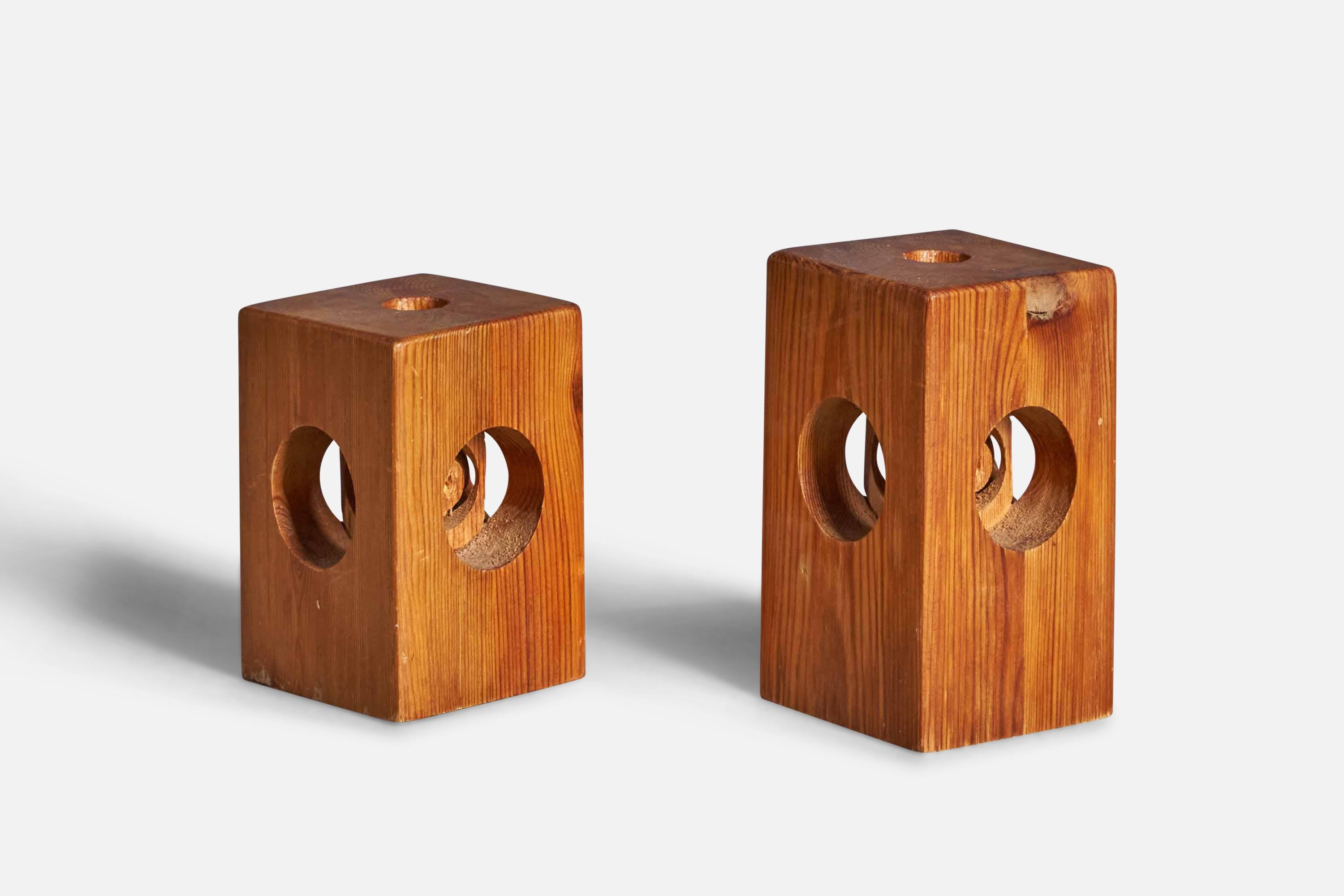 A pair of sculptural pine candle holders designed and produced by Leif Wikner, Sweden, c. 1970s.

Smaller Cube Dimensions (inches): 4.25” H x 3” W x 3” D
Candle Diameter (inches): 0.75”