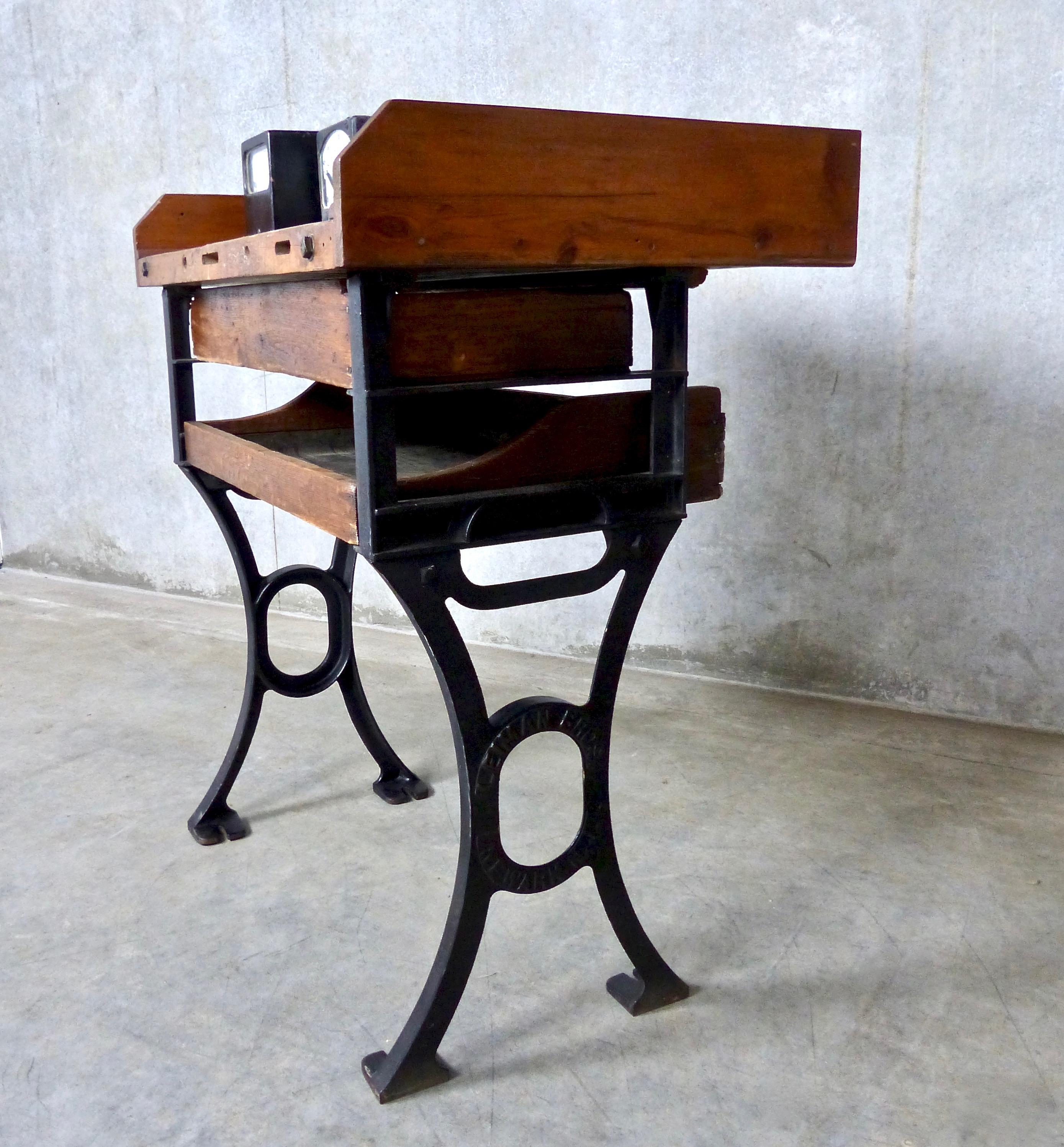 A rare, early 1900s jeweler’s or watchmaker’s workstation by Leiman Bros. of Newark, NJ, which specialized in outfitting entire shops with machinery and equipment. The compact work bench features a cast iron frame, two removable drawers, and a