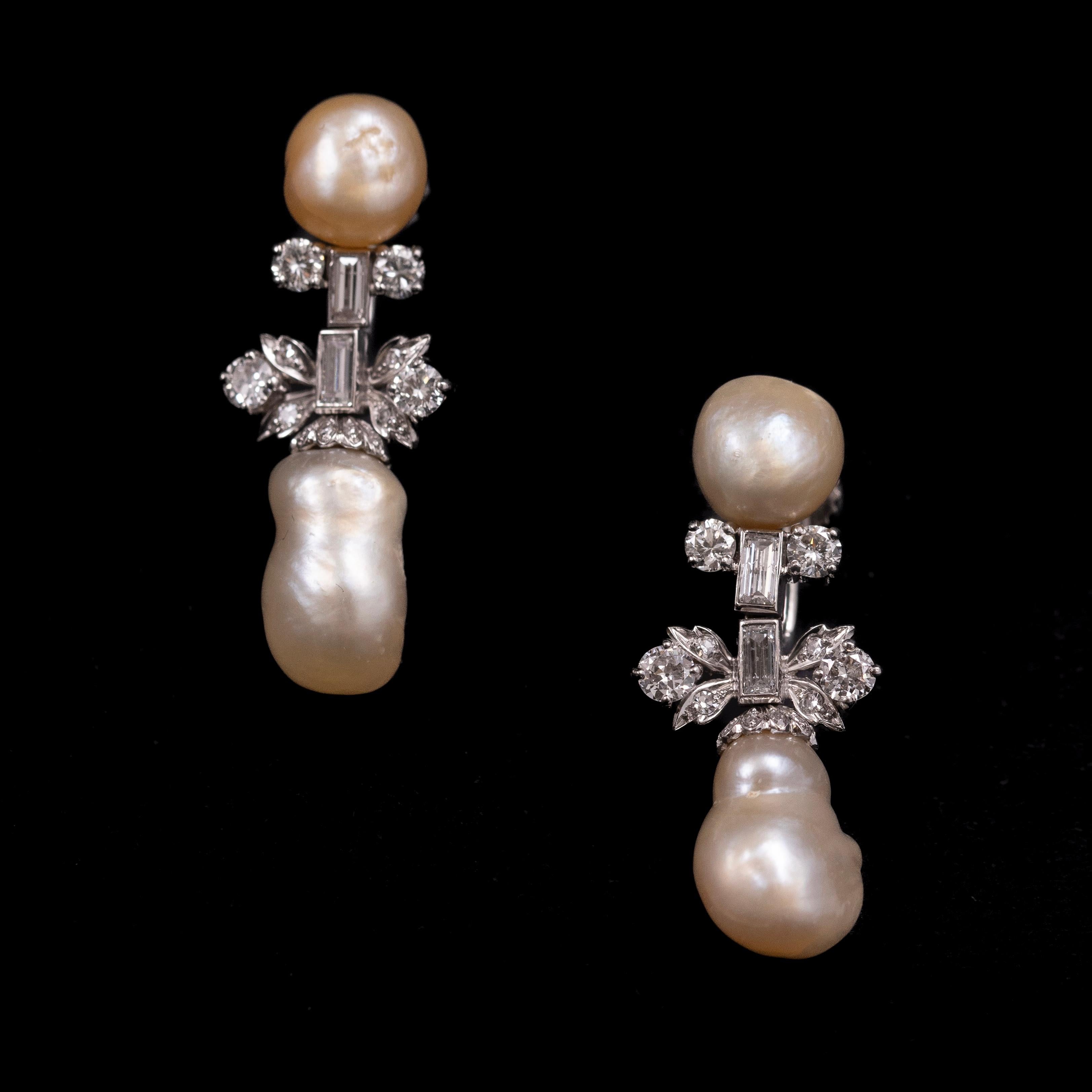 Leitão & Irmão Art Deco Natural Pearl and Diamond Earrings in Platinum, Portuguese, 1940s. A distinguished pair of Art Deco earrings by Leitão & Irmão, renowned Crown Jewelers to the Portuguese and Brazilian Royal Courts. Each earring features a