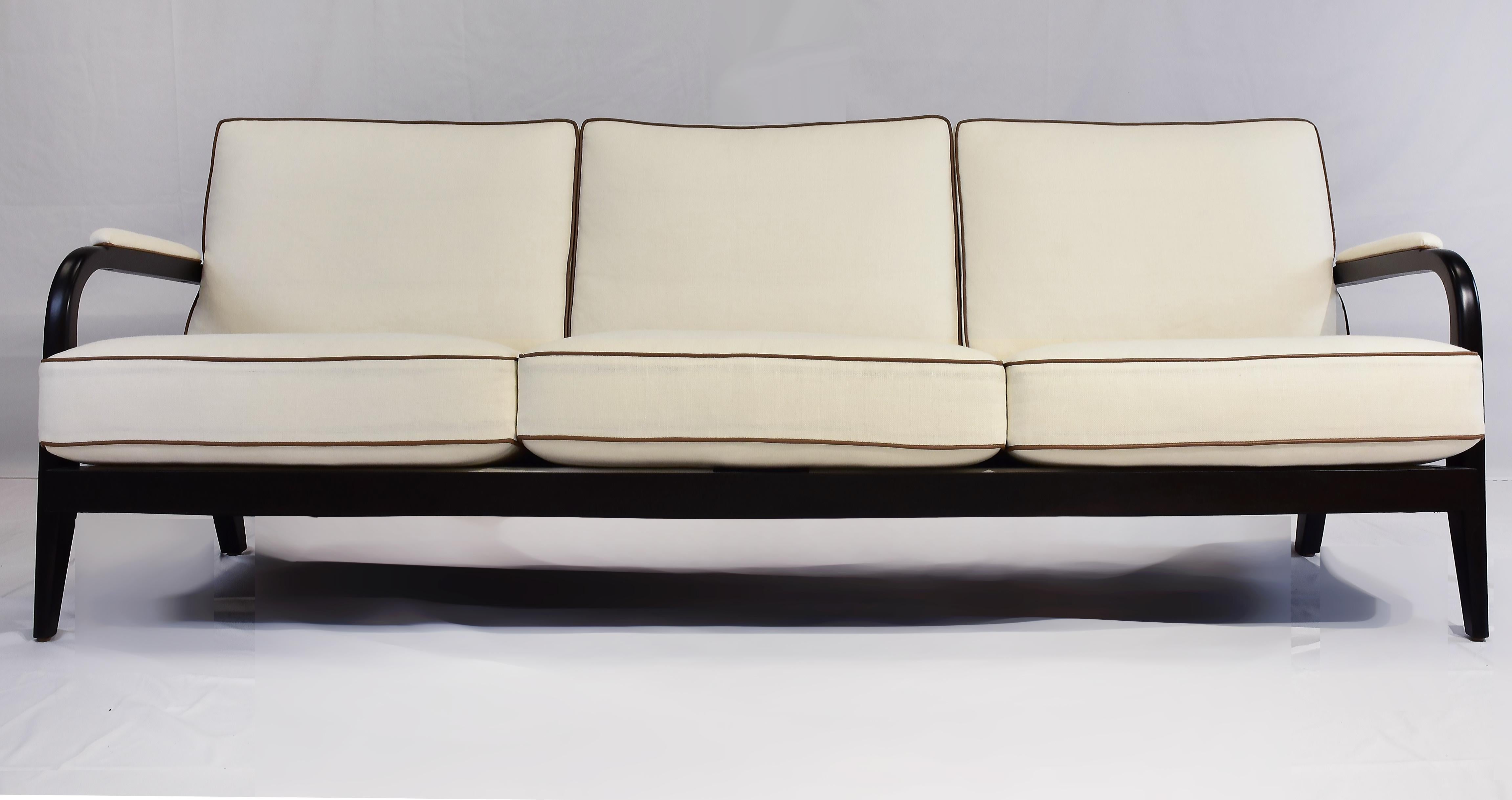 Le Jeune Upholstery 3 Seat Club Havana Sofa Floor Model, Walnut Finished Mahogany

Offered for sale is a three-seat sofa by Le Jeune Upholstery styled as a classical 50s modern design using Mahogany hardwood for the frame. The sofa has three loose