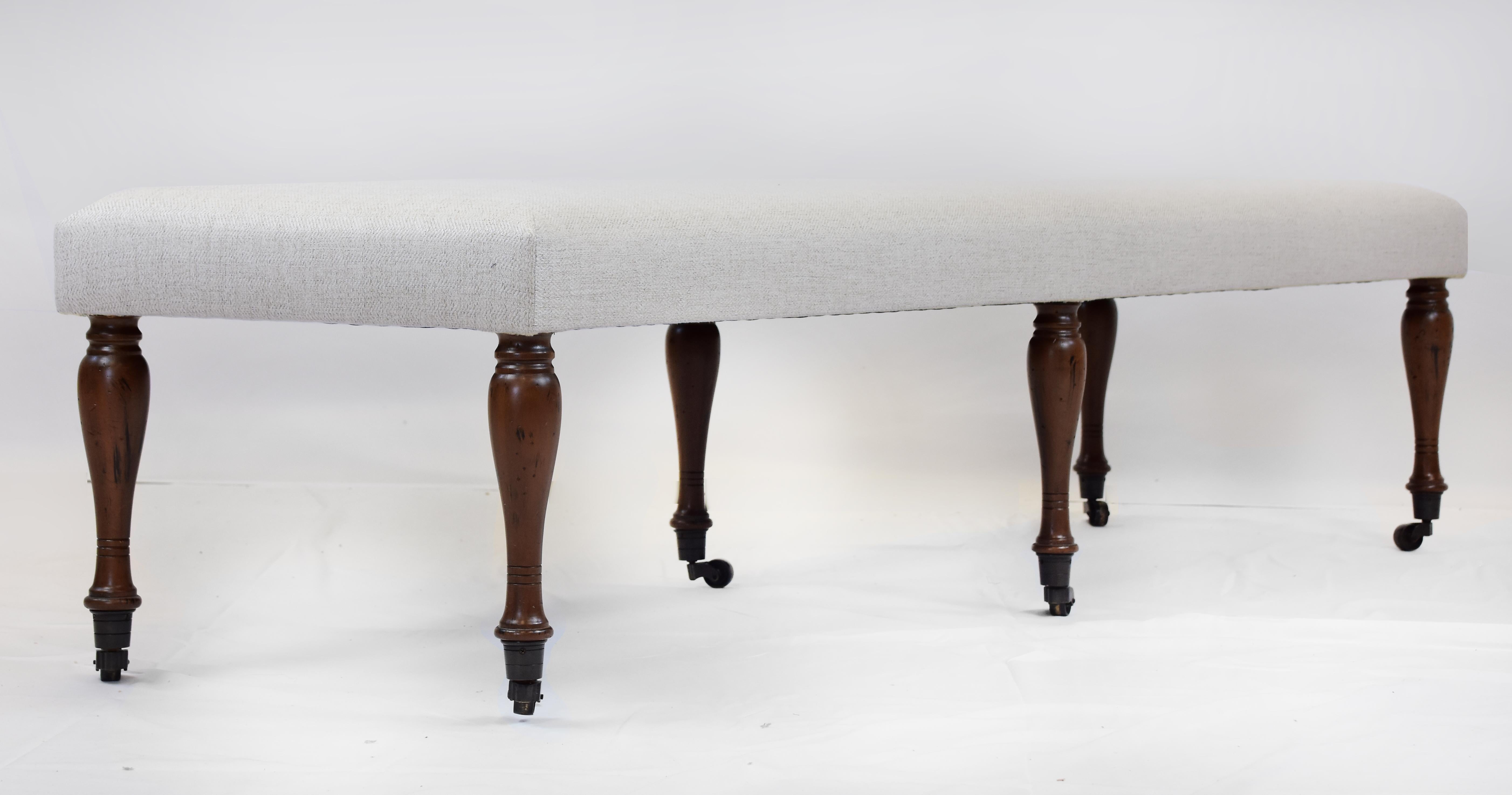 Le Jeune Upholstery Antoinette Long Bench Floor Model with Casters

Offered for sale is the  Antoinette Long Bench showroom model with six turned walnut legs and brass casters created in the 19th-century style.  The legs are finished in a cognac