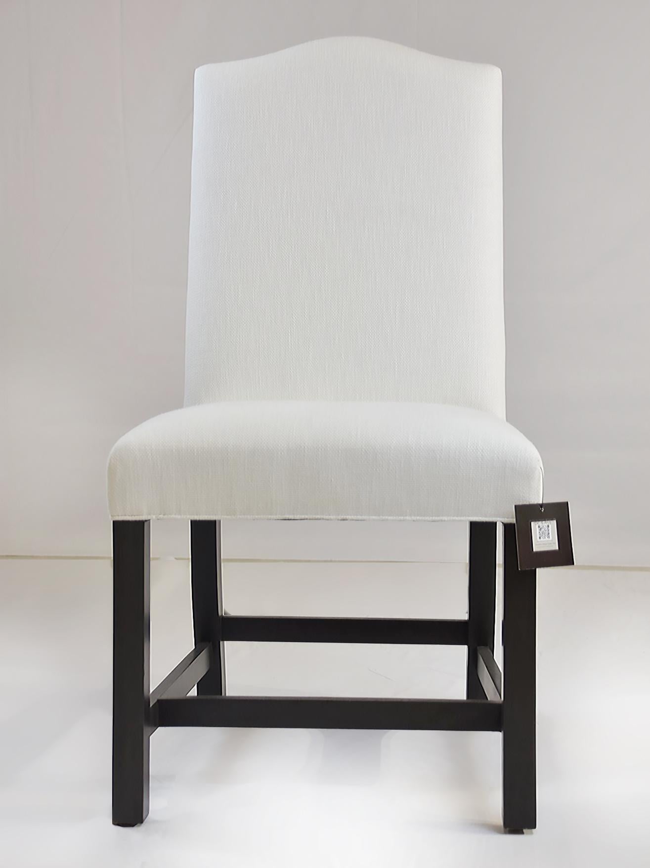  Le Jeune Upholstery Hampshire Armless Dining Side Chair DC1.923 Showroom Model	

 Offered for sale is a Le Jeune Upholstery HAMPSHIRE DC1.923	dining armless side chair created in an English style. The chair has a slight camel back detail on the top