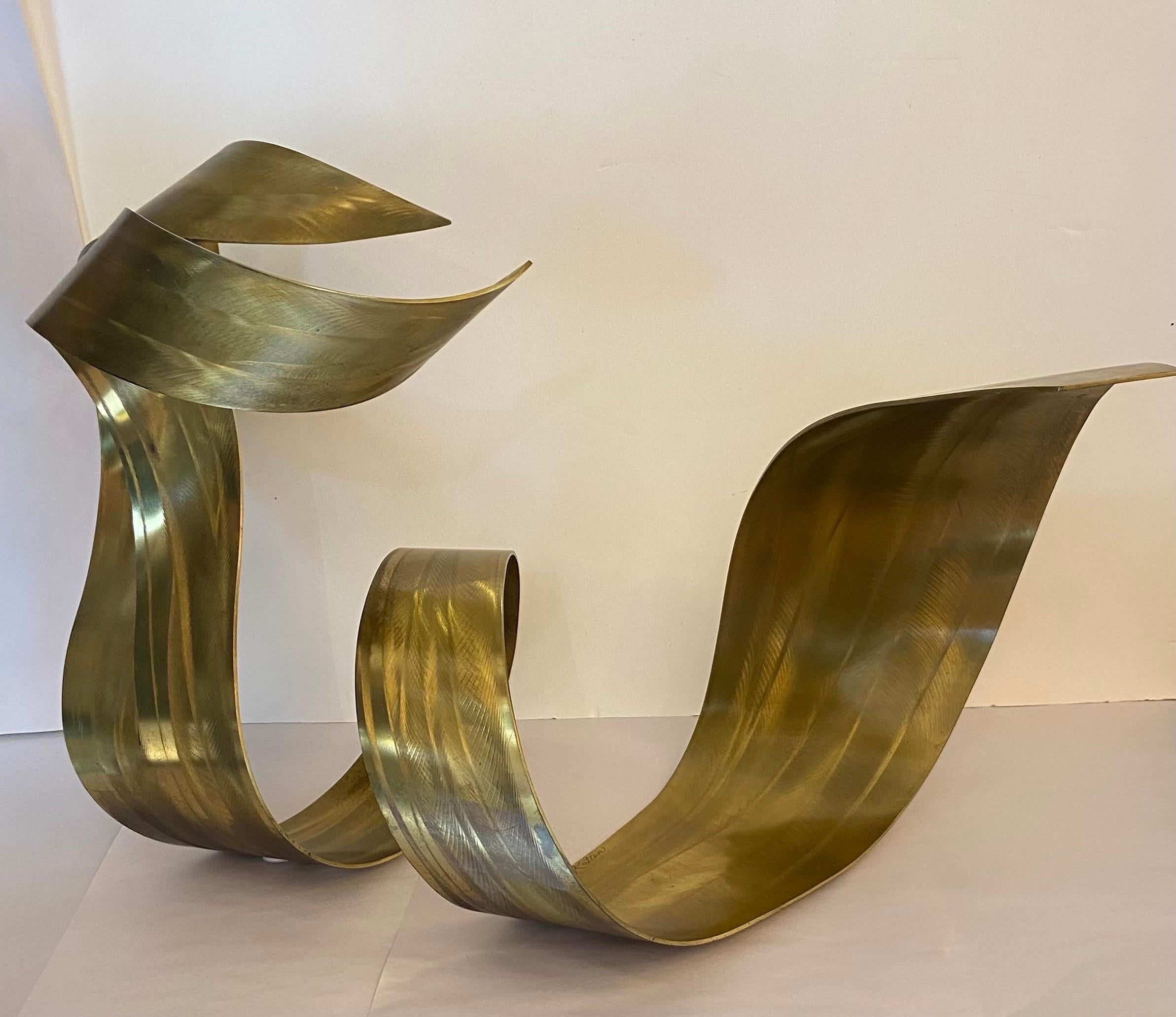 A ribbon design sculpture in varying widths and heights. Etched brass design  .A. Unique sculpture.. 
Not part of a series. Approximately 37” x 24” tall by 17 inches wide
