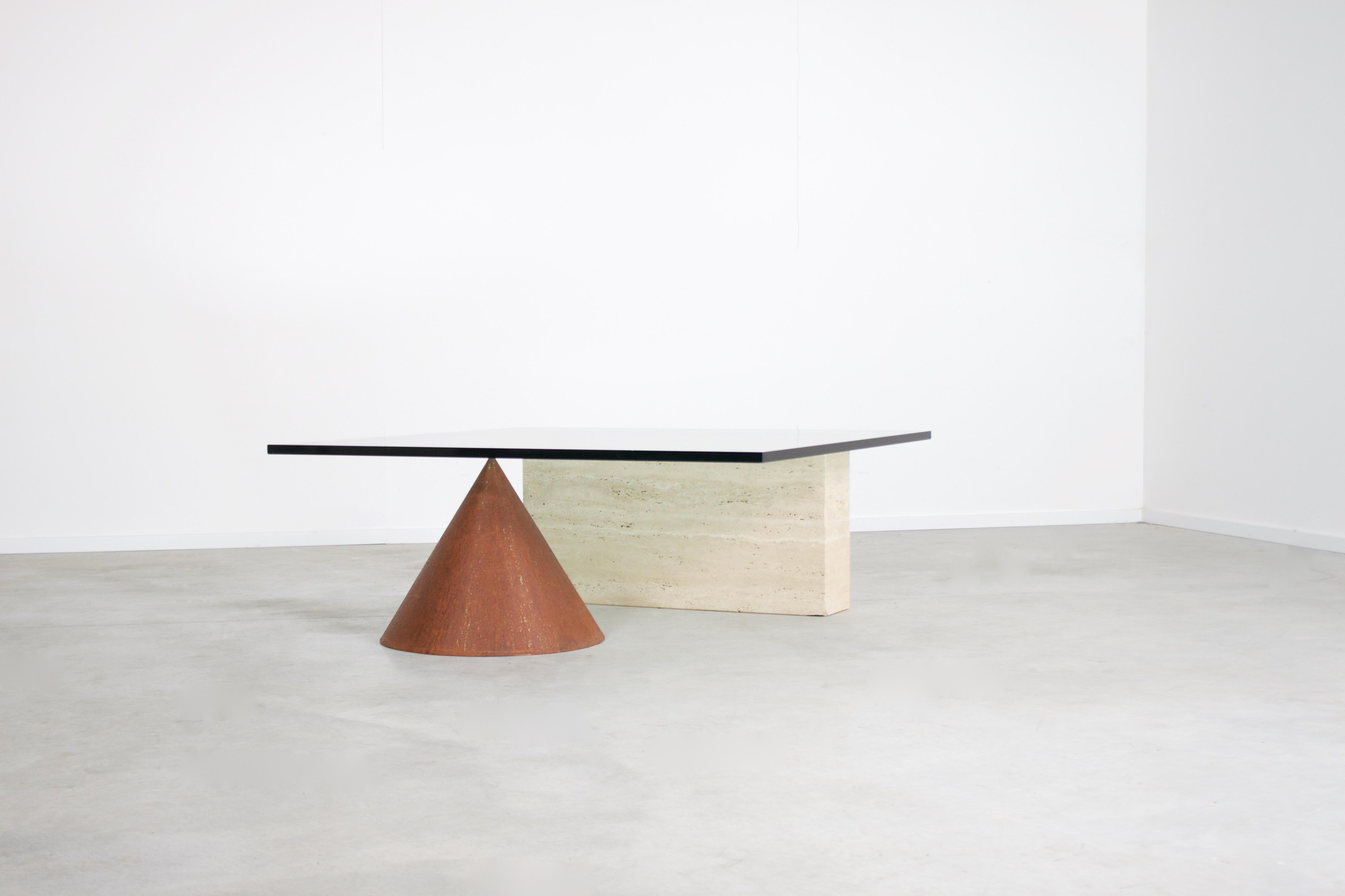 Sculptural Kono coffee table in very good condition.

Designed by Lella & Massimo Vignelli in the 1970s 

Manufactured by Casigliani, Italy

The Kono table consists of a combination of materials and forms.

The thick glass top is resting on a cone