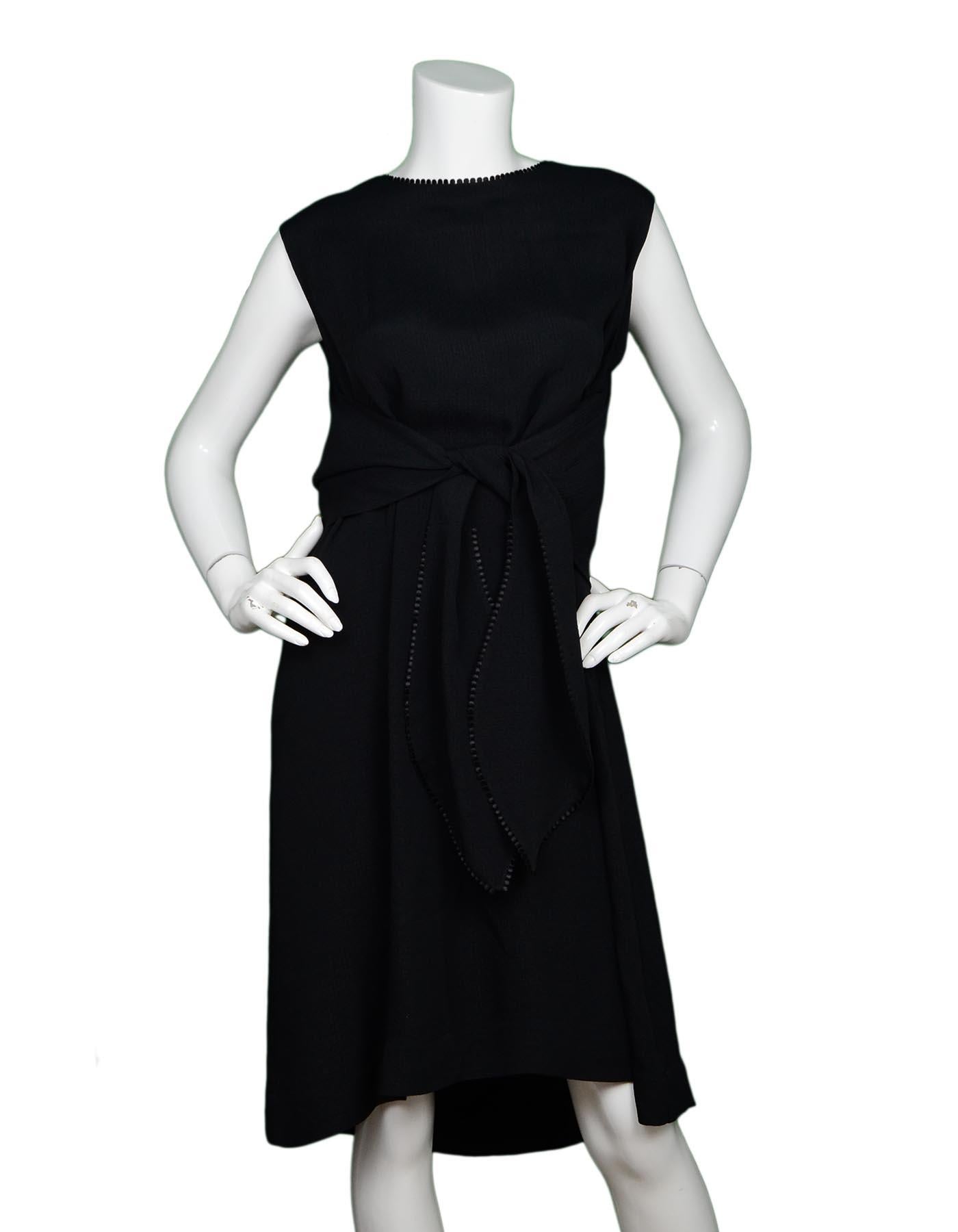Lela Rose Black Sleeveless Trapeze Dress Sz 16

Made In:  USA
Color: Black
Materials: 82% acetate, 18% viscose
Opening/Closure: Hidden back zipper with hook eye at top
Overall Condition: Excellent pre-owned condition 

Measurements: 
Shoulder To