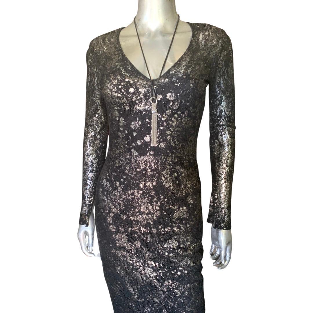 Purchased at Neiman Marcus Beverly Hills is this chic black lace dress by Lela Rose. Retailed for over $1800. The highlight of the dress is a silver metallic splatter print painted over the lace to give it a super modern look. Deep V neck front.