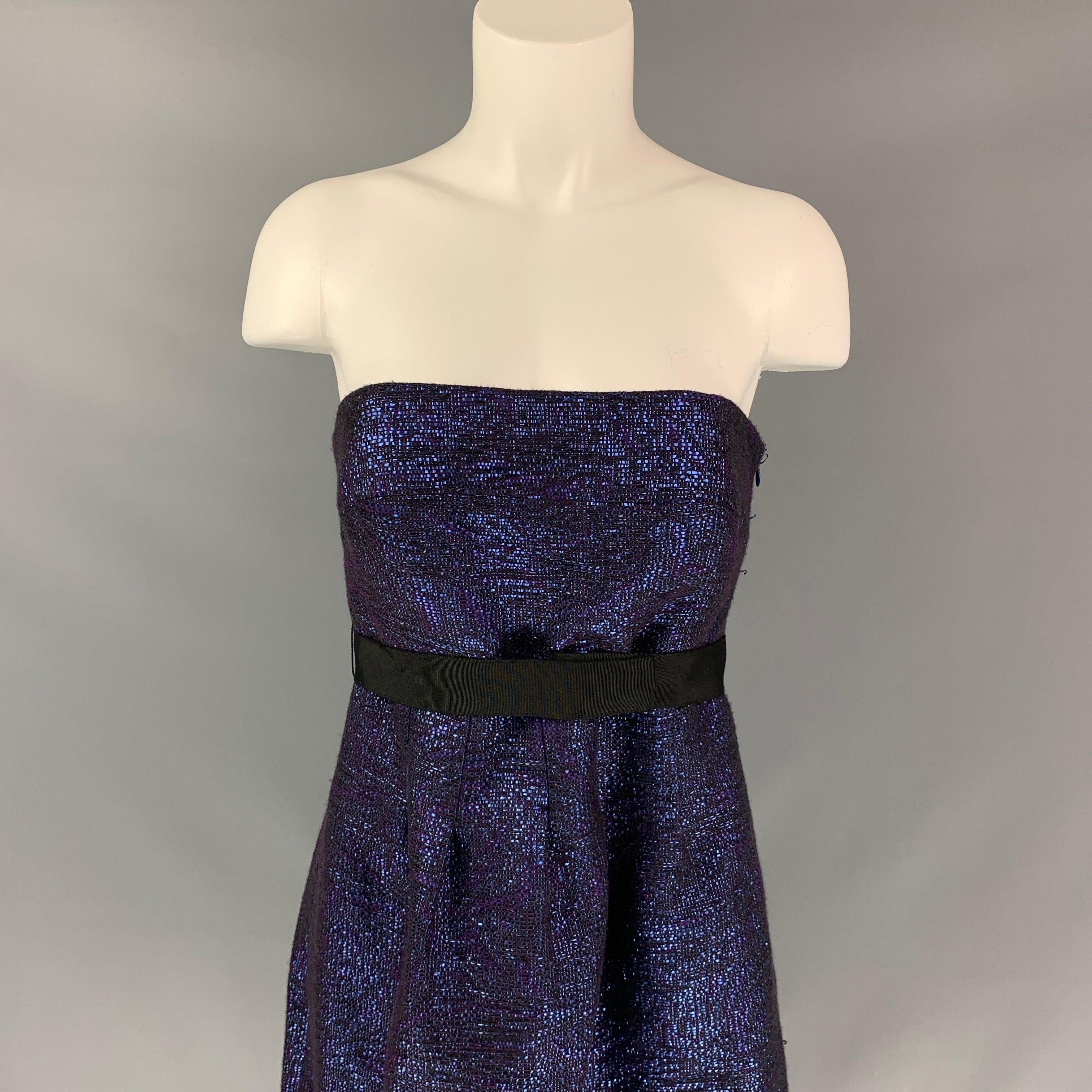 LELA ROSE dress comes in a blue & black acrylic blend featuring a belt strap detail, pleated, hook & loop details, and a side zipper closure.
Very Good
Pre-Owned Condition. 

Marked:   6 

Measurements: 
  Bust: 30 inches Waist: 28 inches  Hip: 38