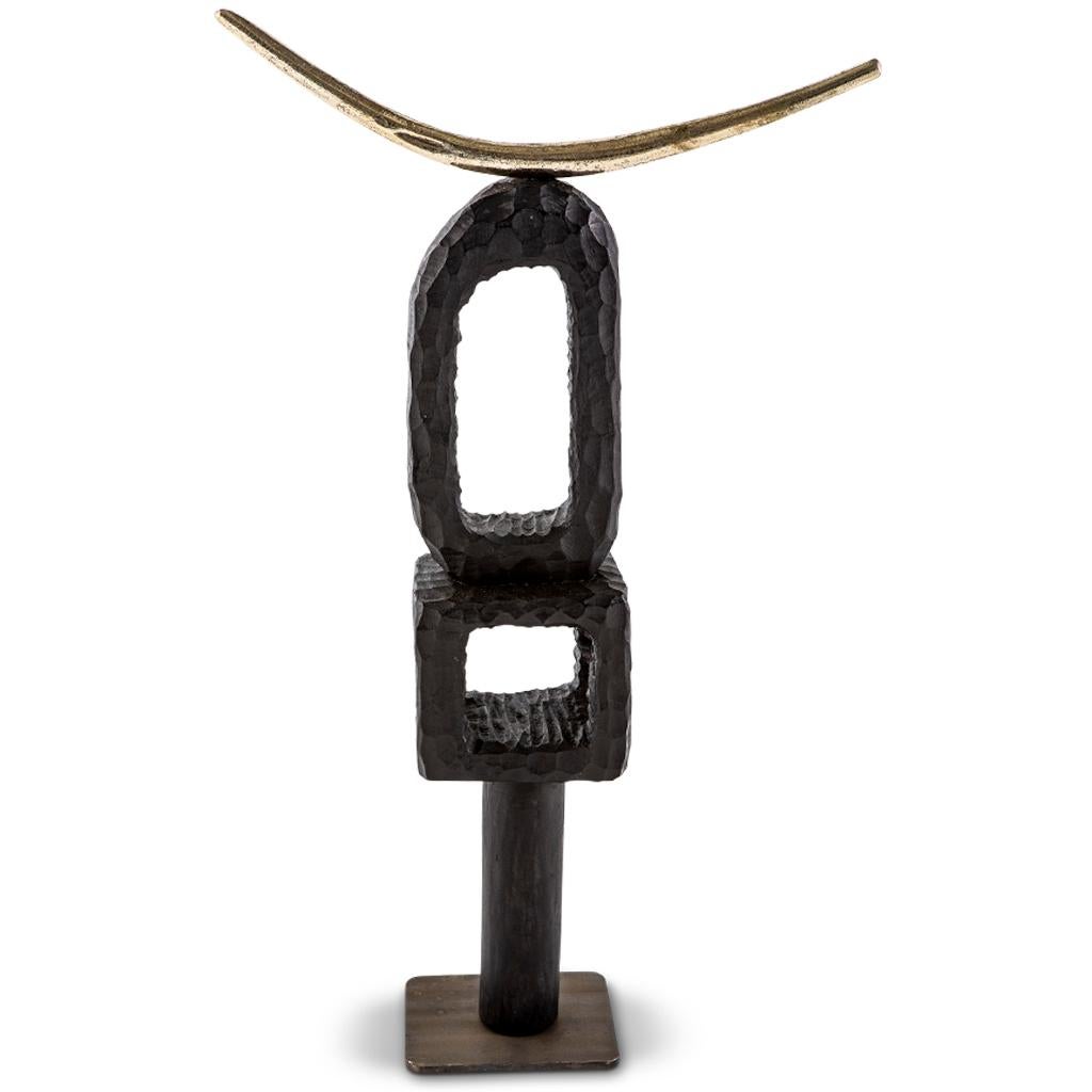 All our TOTEM sculptures are hand carved in Southern Africa from sustainable alien timber by a group of Zimbabwean artists who set their own prices, thus making them fair trade. We then take these carvings and add to them solid sand cast brass