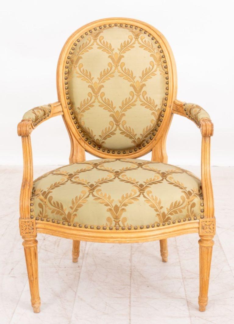 Louis XVI Beechwood Fauteuil, stamped J. B. Lelarge (Jean-Baptiste III Lelarge, French, 1743-1802, maitre ebeniste in Paris, 1775), with oval moulded upholstered back, scrolling arms above a serpentine seat with paterae headed tapering stop-fluted