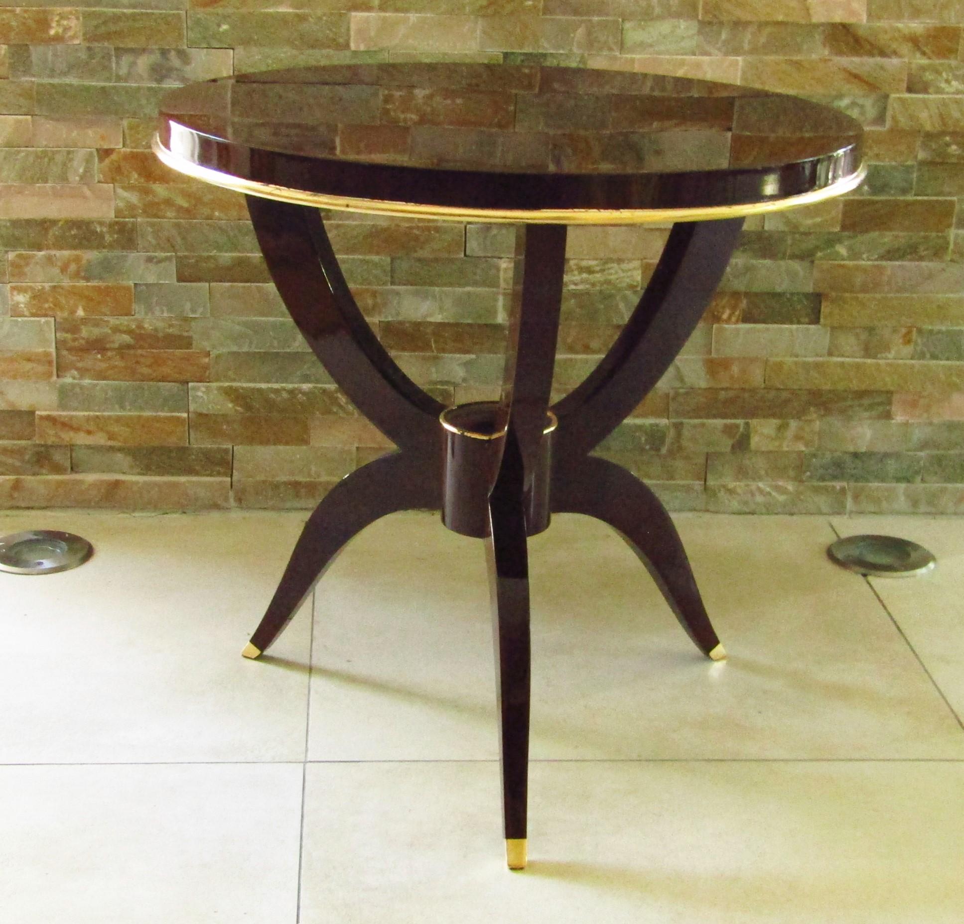 Art Deco side table, France, 1930. Rosewood with gold leaf details. Fully restored with high gloss hand polished lacquer.

Jules Leleu attributed.

