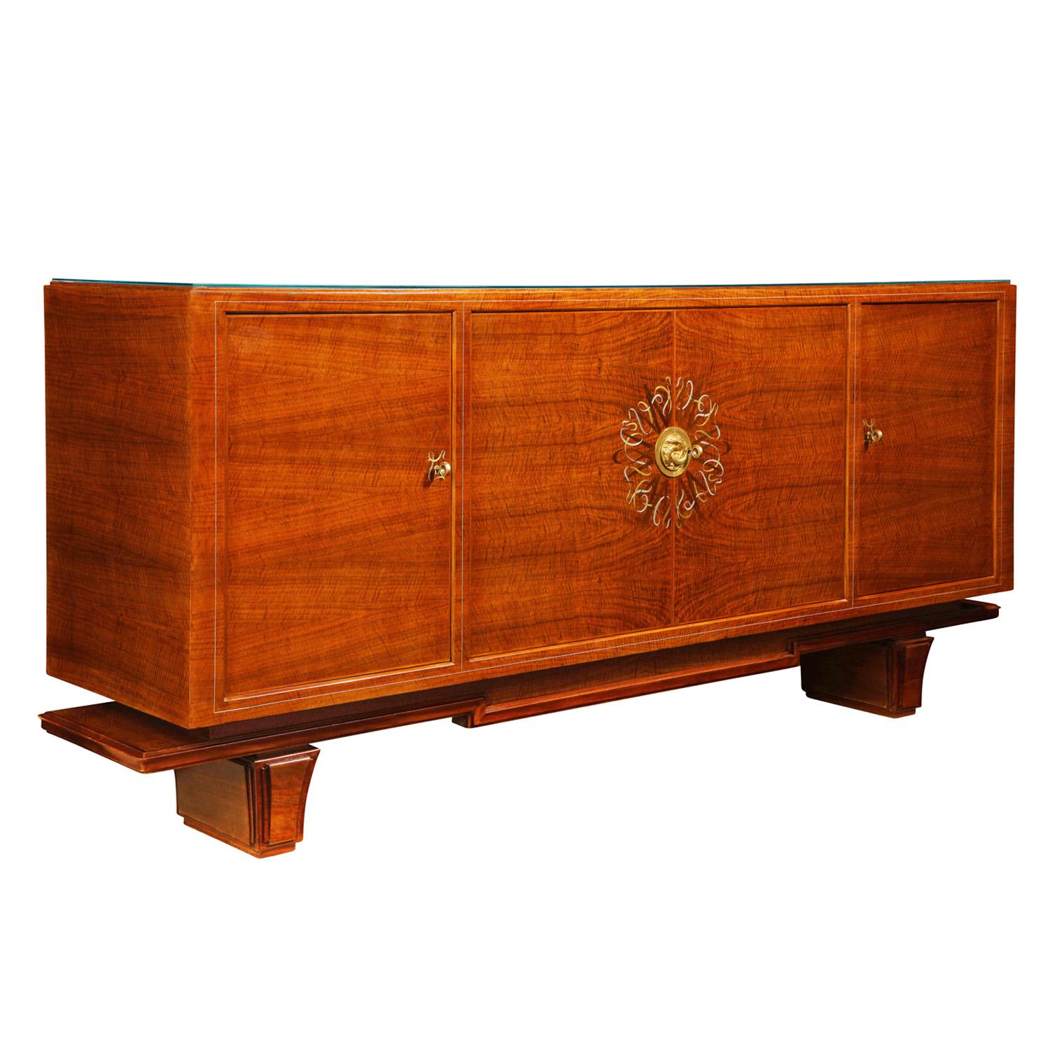 Extraordinary 4 door Art Deco credenza in book-matched rosewood with ribbon inlays in pewter and bronze with solid brass artisan center medallion of 3 swimming dolphins and delicate mother-of-pearl inlays around the outside of the front by