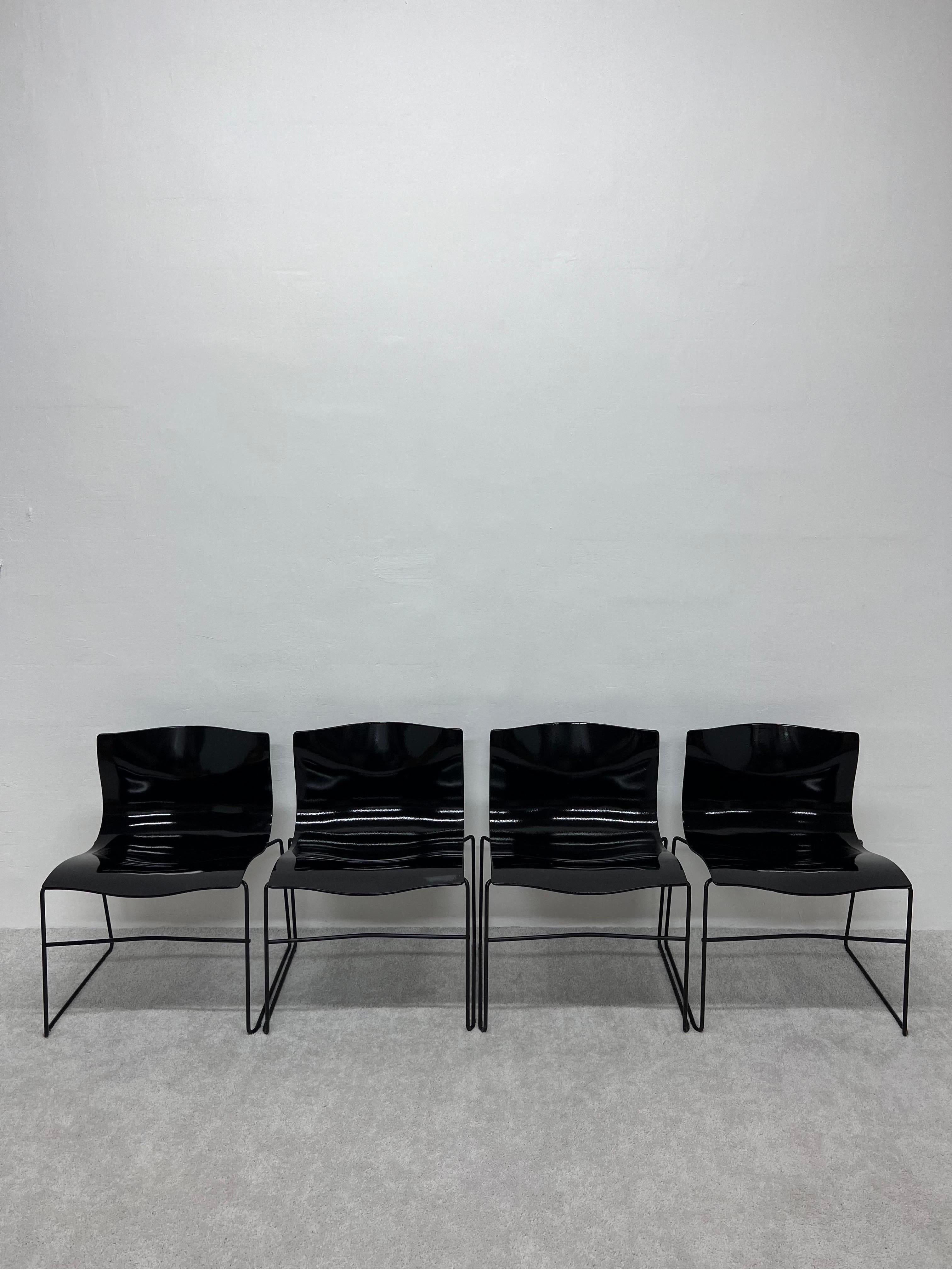 Black high-gloss lacquered Handkerchief chairs on black lacquered frames by Lella and Massimo Vignelli for Knoll.

In 1968 Vignelli was contracted by Knoll to re-envision the corporate identity and graphics program, resulting in the Knoll logo in