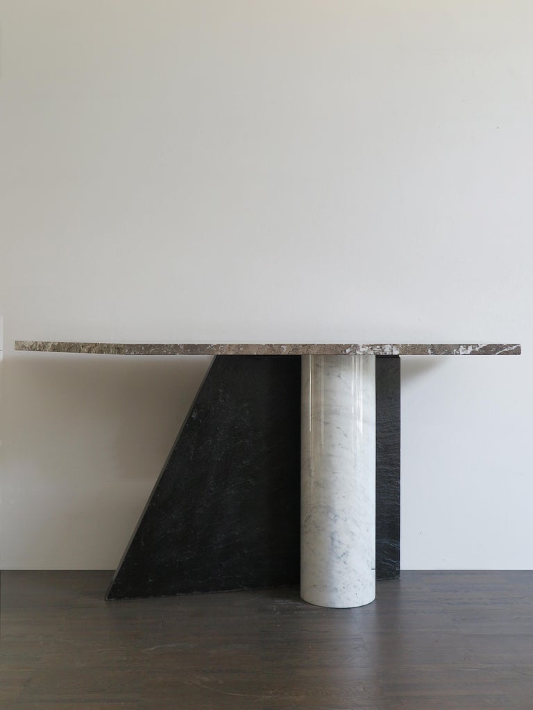 Italian console table model Ambiguità designed by Lella and Massimo Vignelli and produced by Casigliani in the 1980s, composed of three elements in Slate and Marble, the parts can be fixed either by interlocking or with screws, the top has a rough,
