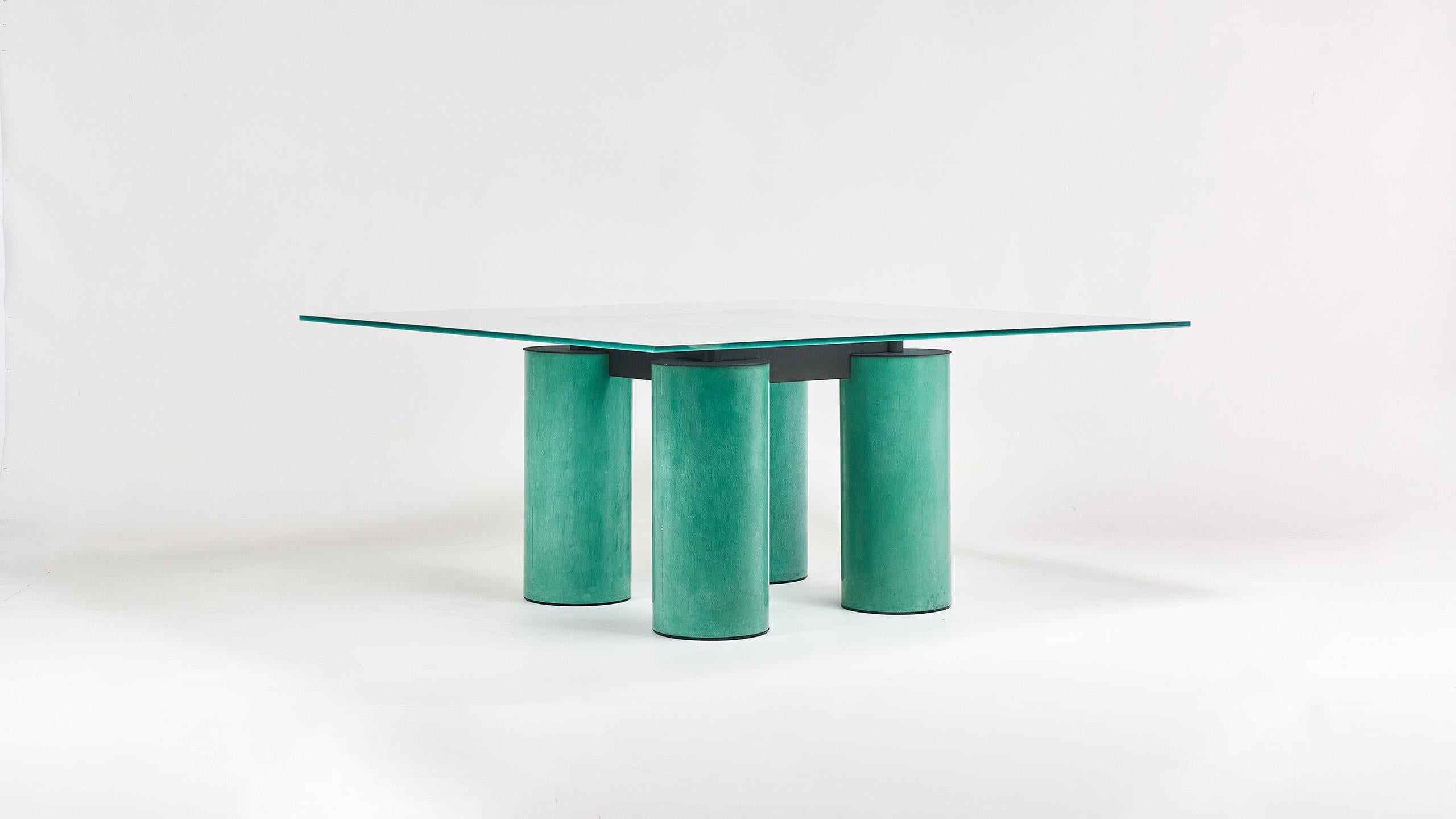 Square dining table by designers Lella & Massimo Vignelli and David Law for Acerbis, circa 1980.

Dating from the 80's, this iconic table has the particularity of joining the aesthetic codes of the Memphis movement to the traditional technique of