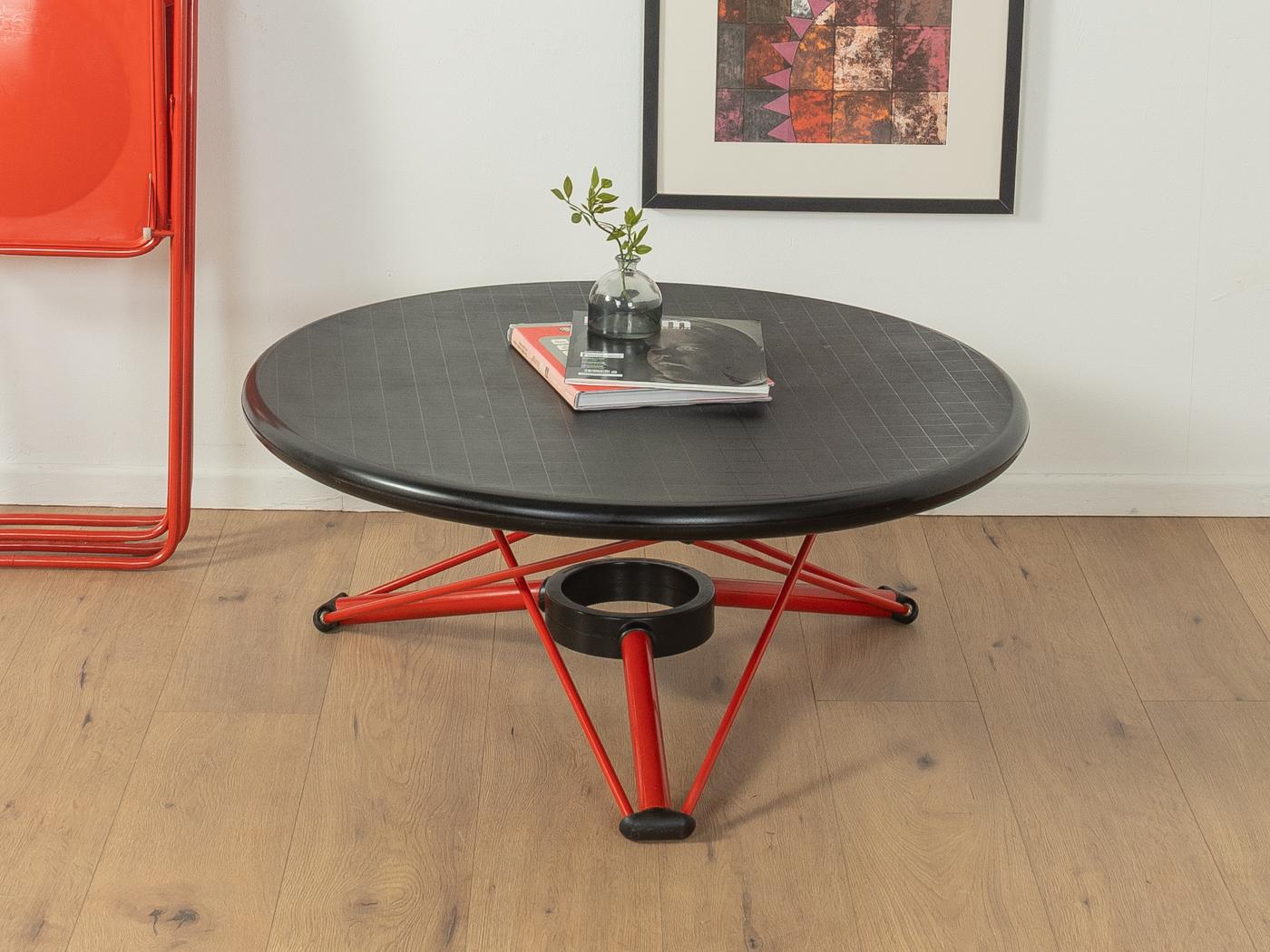 LEM dining table from the 1980s by Andries & Hiroko Van Onck for Magis. Height-adjustable metal frame in red with black plastic table top, that can be snapped into any position. 

Quality Features:
accomplished design: perfect proportions and