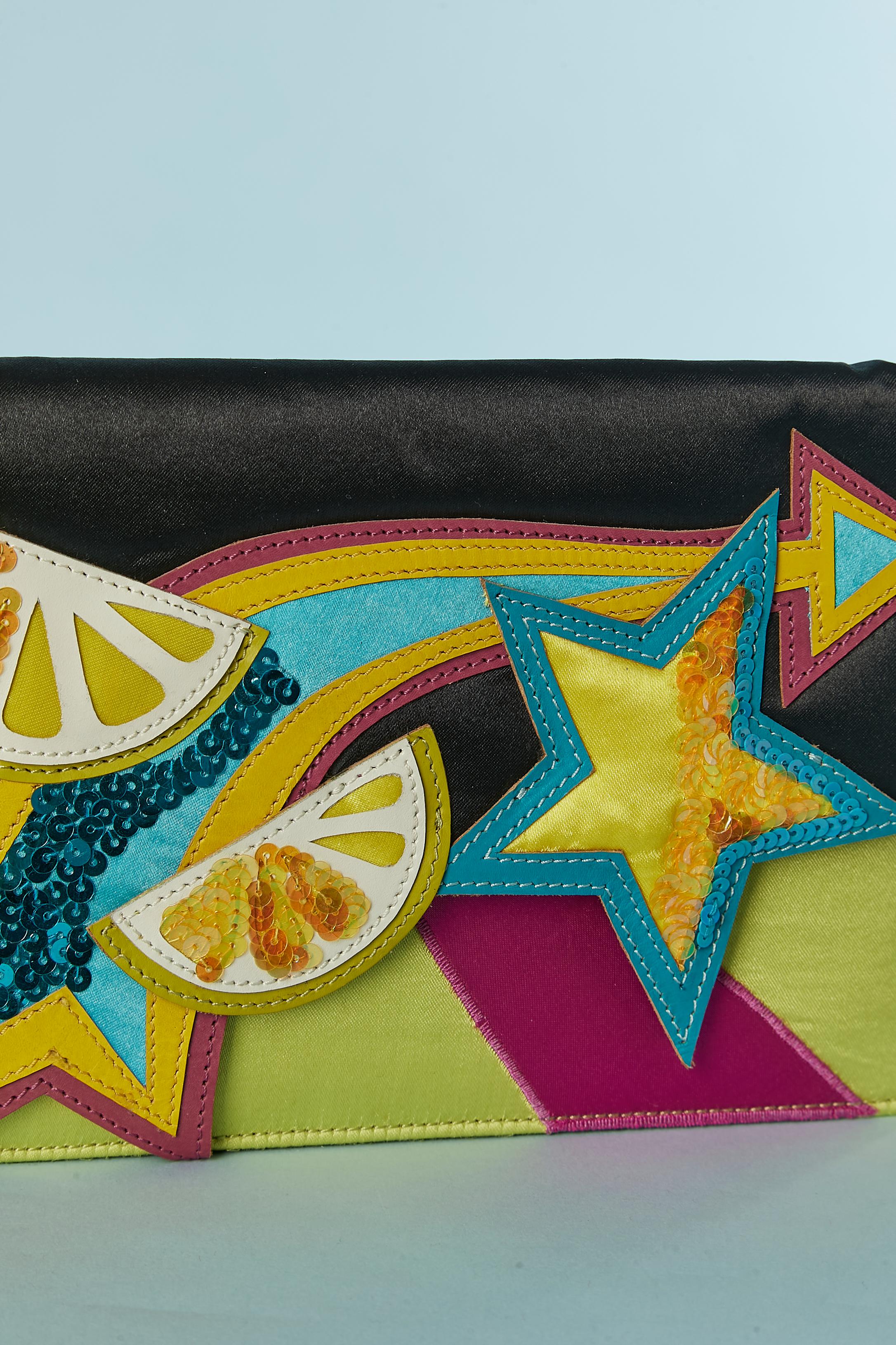 Lemon and star satin evening bag with sequin embellishment.  Snap closure under the top flap. 
SIZE : 23cm X 15cm X 3cm 
Strap lenght : 53cm 