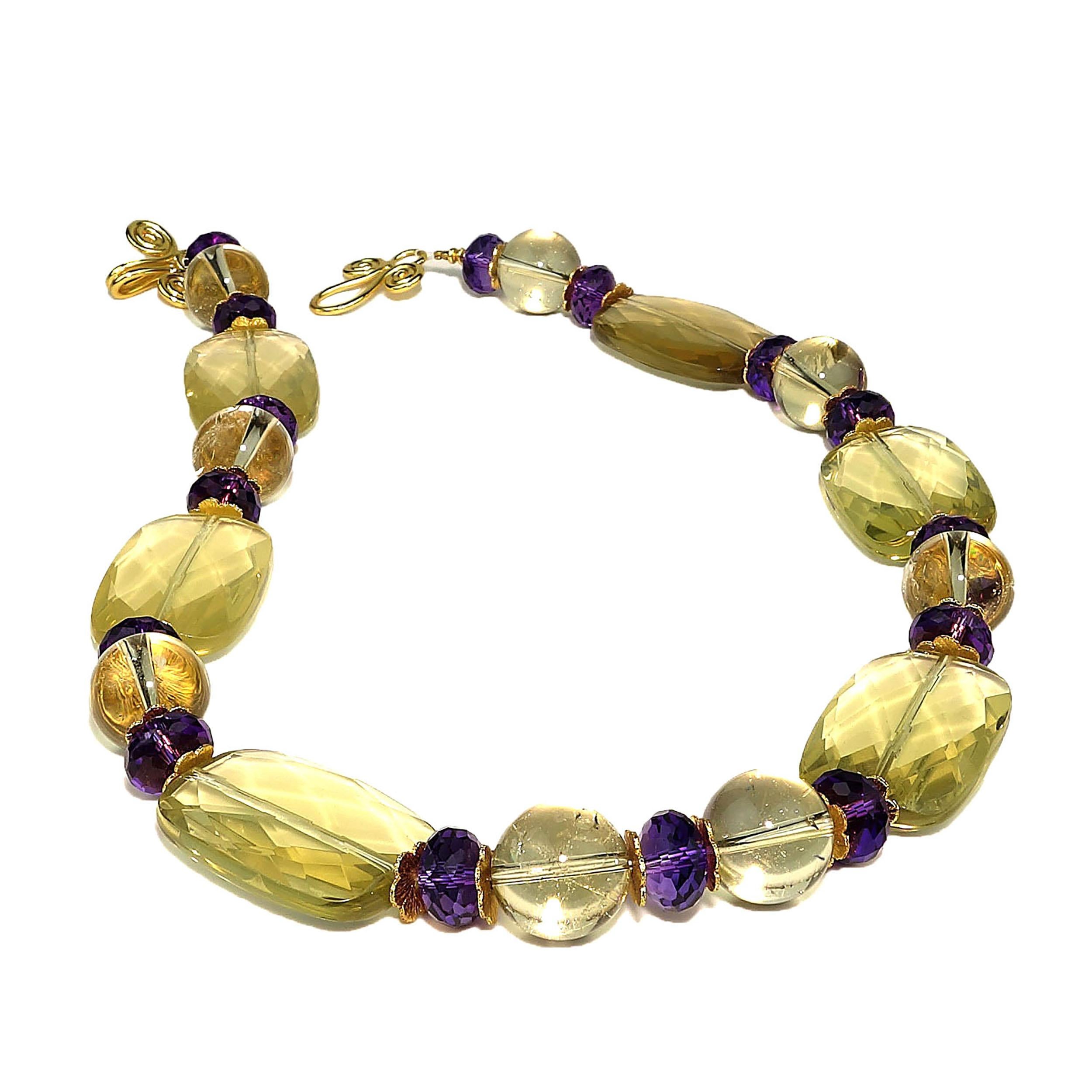 Custom made Lemon Quartz and Amethyst Necklace with gold tone accents.  This unique 18.5 inch necklace features rectangles of beautifully faceted Lemon Quartz, Lemon Quartz spheres, and sparkling Amethyst rondelles.  It is finished with a gold