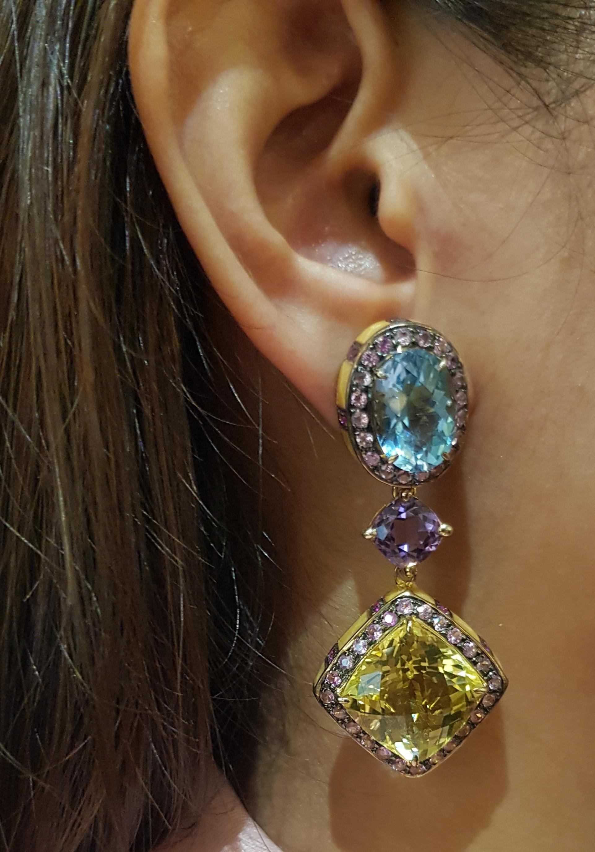 Lemon Quartz, Blue Topaz, Amethyst and Rainbow Colour Sapphire Earrings set in Silver Settings

Width:  2.5 cm 
Length: 5.7 cm
Total Weight: 36.11 grams

*Please note that the silver setting is plated with gold and rhodium to promote shine and help
