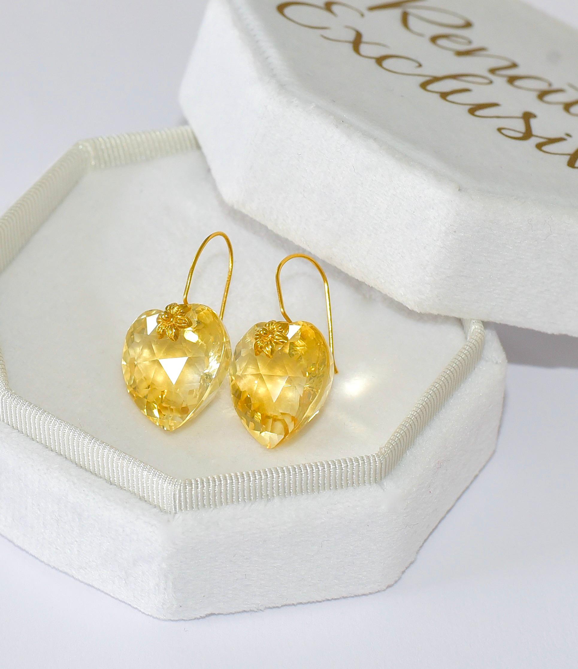This unique pair of lab-created African Lemon Quartz (19mm x 20mm) earrings are like a goddess! 18K Solid yellow Gold delicate details give the earrings a feminine look. Simple sophistication for your everyday accessories! The perfect gift for the