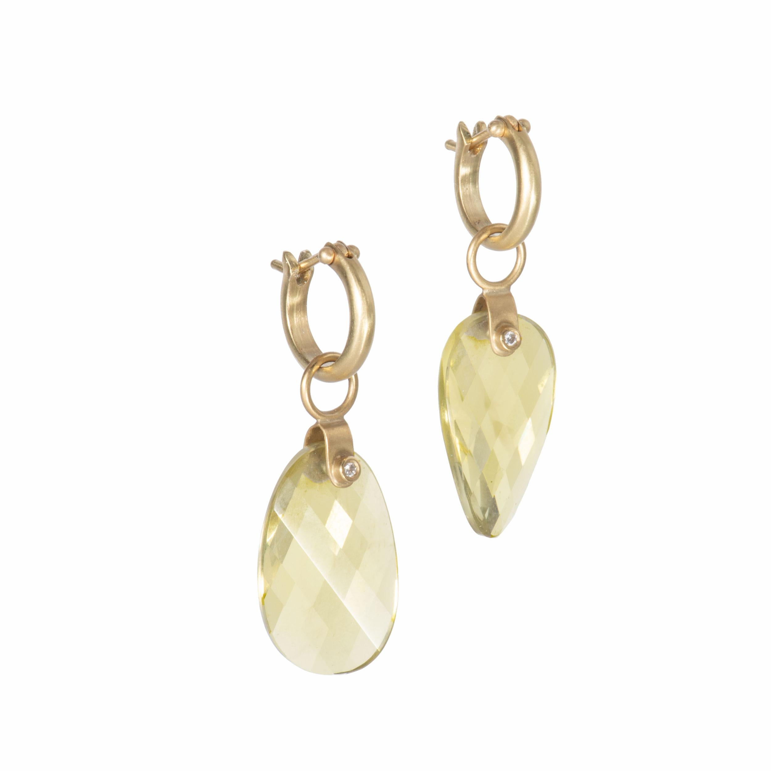 Lemon Quartz Petal Drop Earrings curve to catch the wink and play of light on facets, appearing oval, pointed and heart shaped as they swing from 18k gold stirrup mounts set with .04ctw round white diamonds. Verdant lemon, grapefruit and green grape